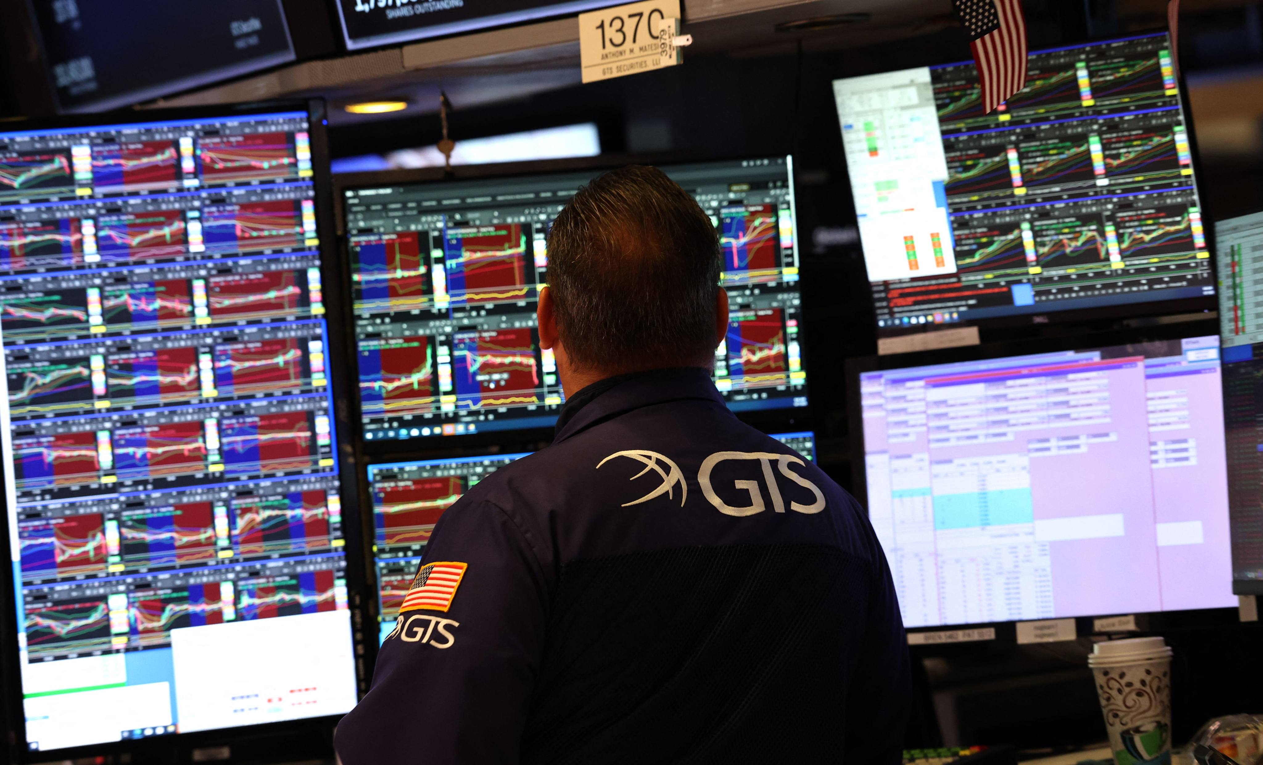 A trader works at his desk on the floor of the New York Stock Exchange on Tuesday. Photo: AFP