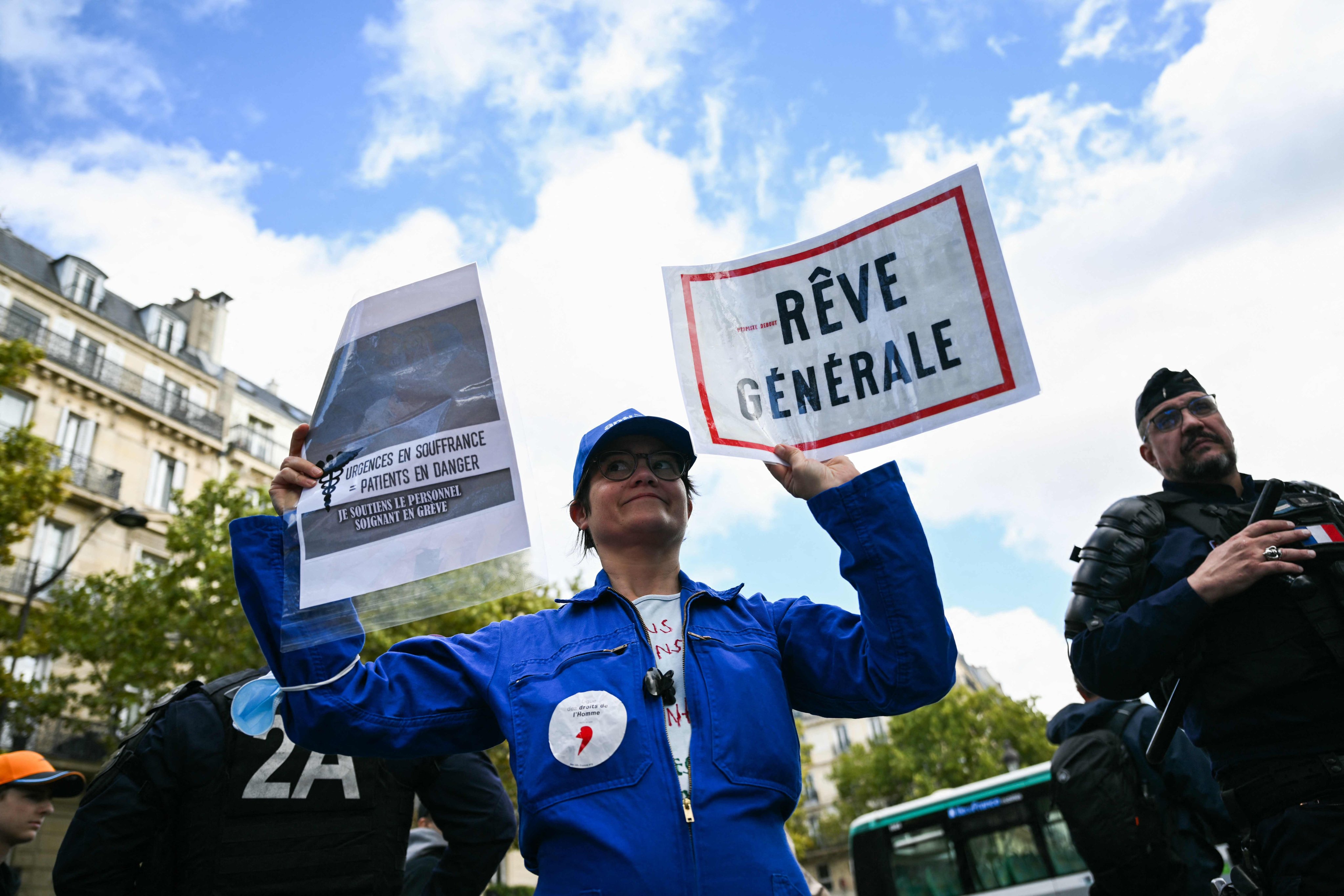 A protester holds a sign reading “General dream” as healthcare workers take part in a rally in Paris on Saturday called by doctors’ unions to demand the protection of health budgets. Photo: AFP