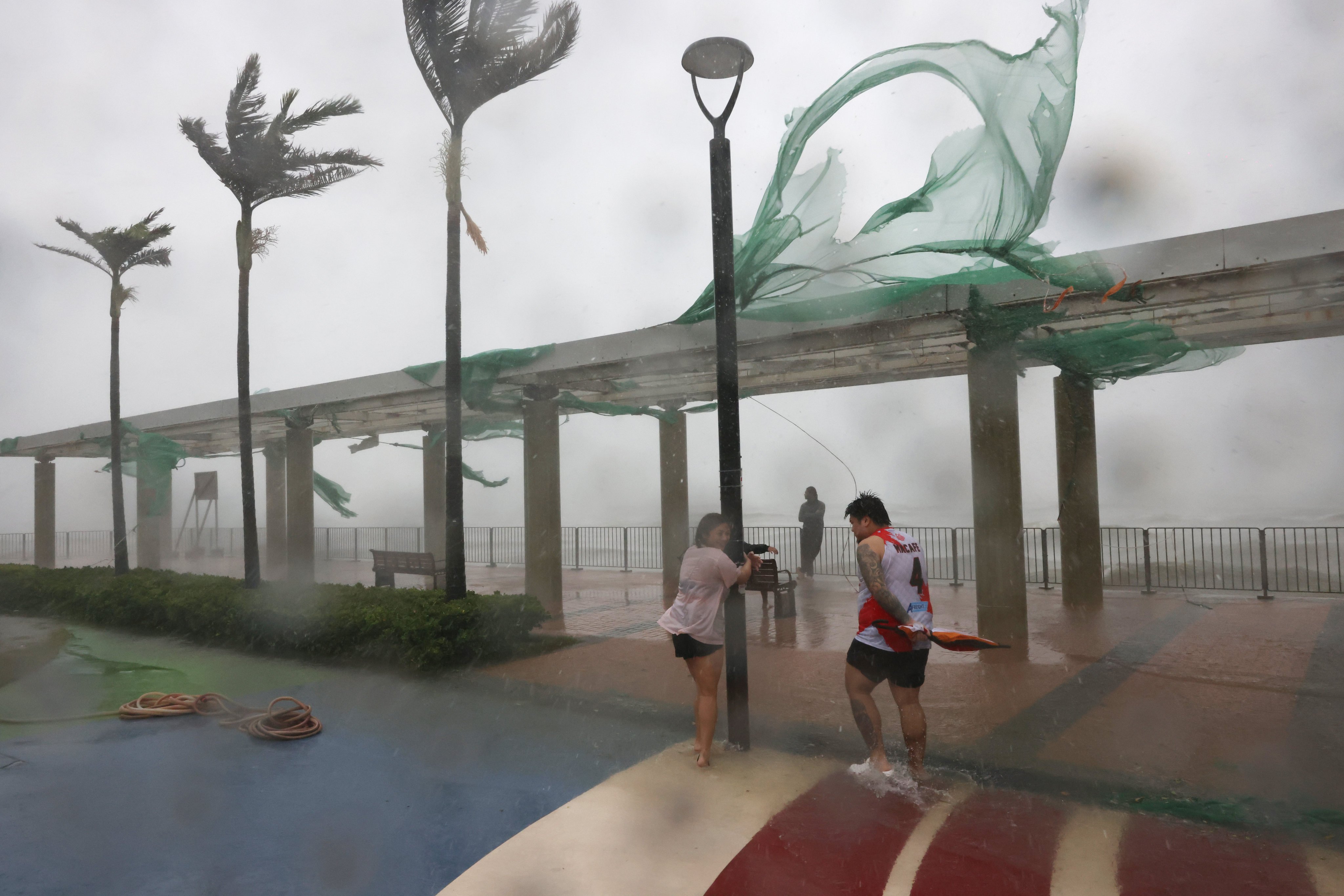 Thrill seekers take to Hung Hom pier as Super Typhoon Ragasa passes through Hong Kong. Photo: Nora Tam
