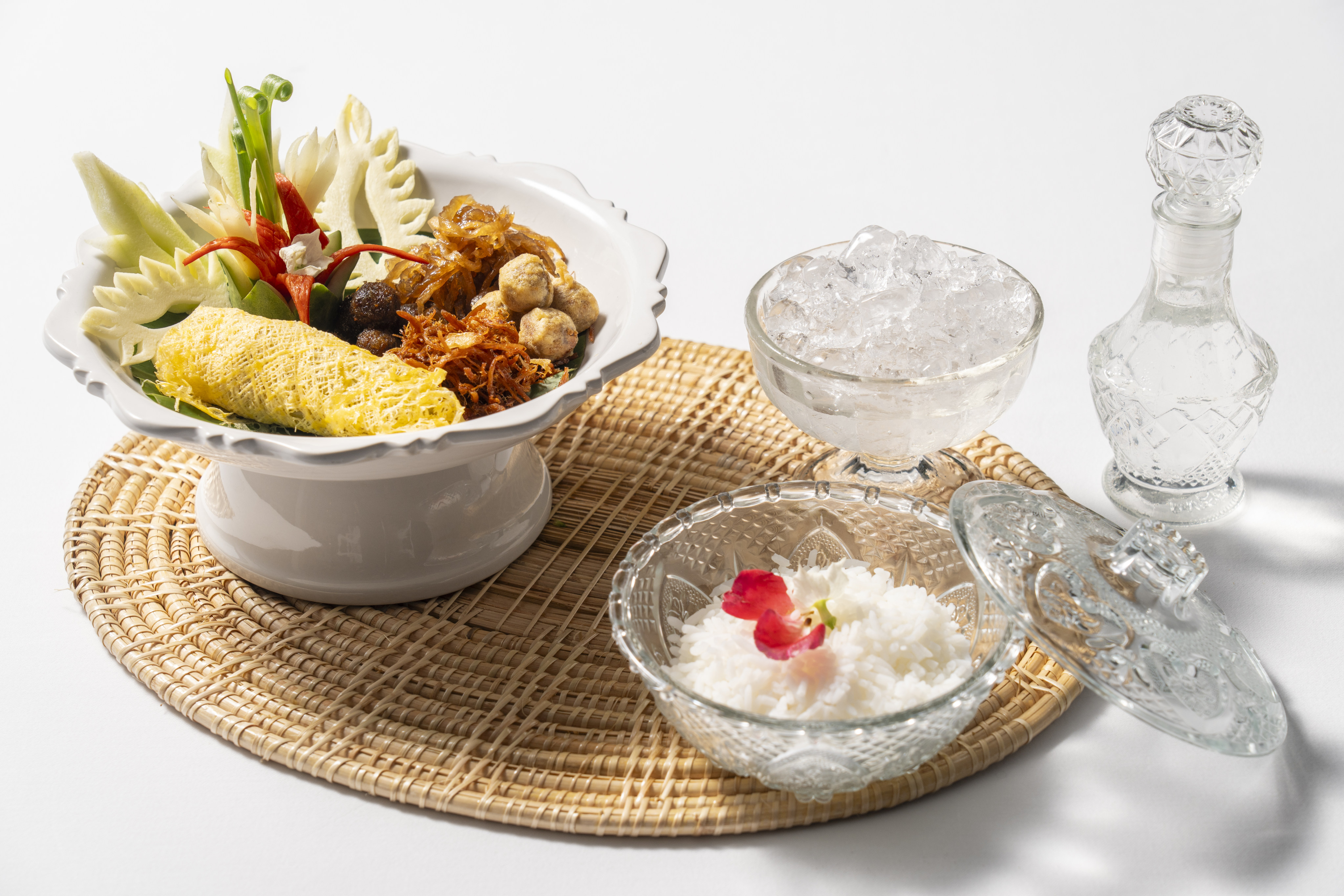 Khao chae at Pribpri restaurant at the Devasom Hua Hin Resort in Thailand. A Thai palace cuisine dish, it includes cool, perfumed rice with iced, jasmine-scented water and side dishes such as shrimp paste balls, sweet fried fish, stuffed green peppers wrapped in egg, pork floss and stir-fried preserved radish in coconut milk. Photo: Devasom Hua Hin