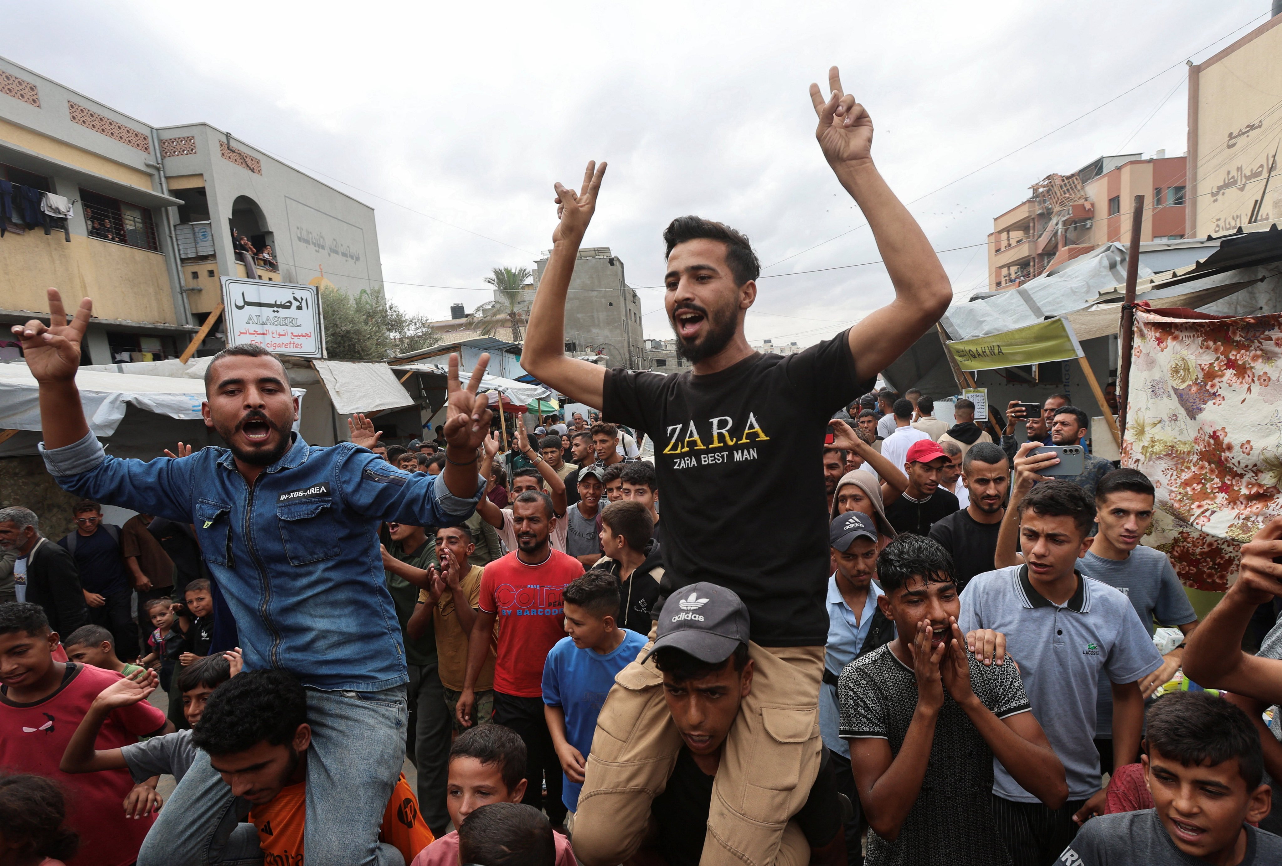 Palestinians in Khan Younis on Thursday celebrate, after US President Donald Trump announced that Israel and Hamas agreed on the first phase of a Gaza ceasefire. Photo: Reuters