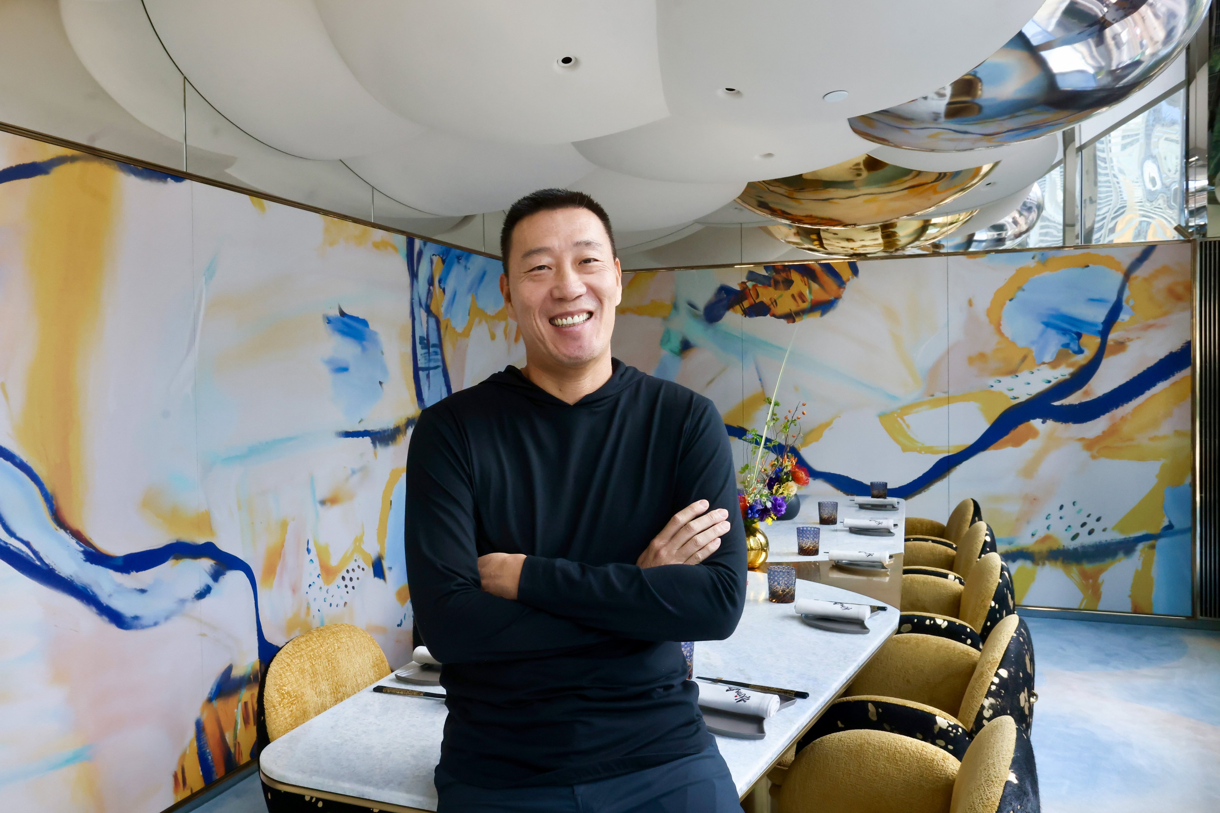 Akira Back poses for a photo at his new restaurant in The Henderson in Central, Hong Kong. The Korean-American chef talks about sharing his journey – from professional snowboarder to restaurateur – through food. Photo: Jonathan Wong