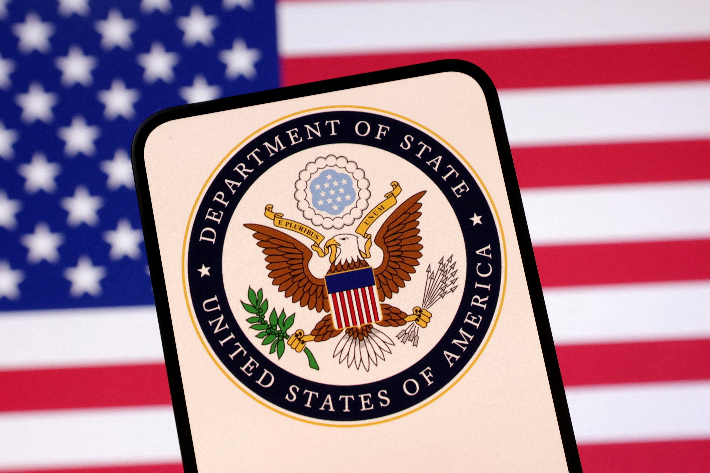The US State department logo is seen in front of the American flag. The US said earlier this year that it would restrict employees in China from entering romantic relationships with locals. Photo illustration: Reuters