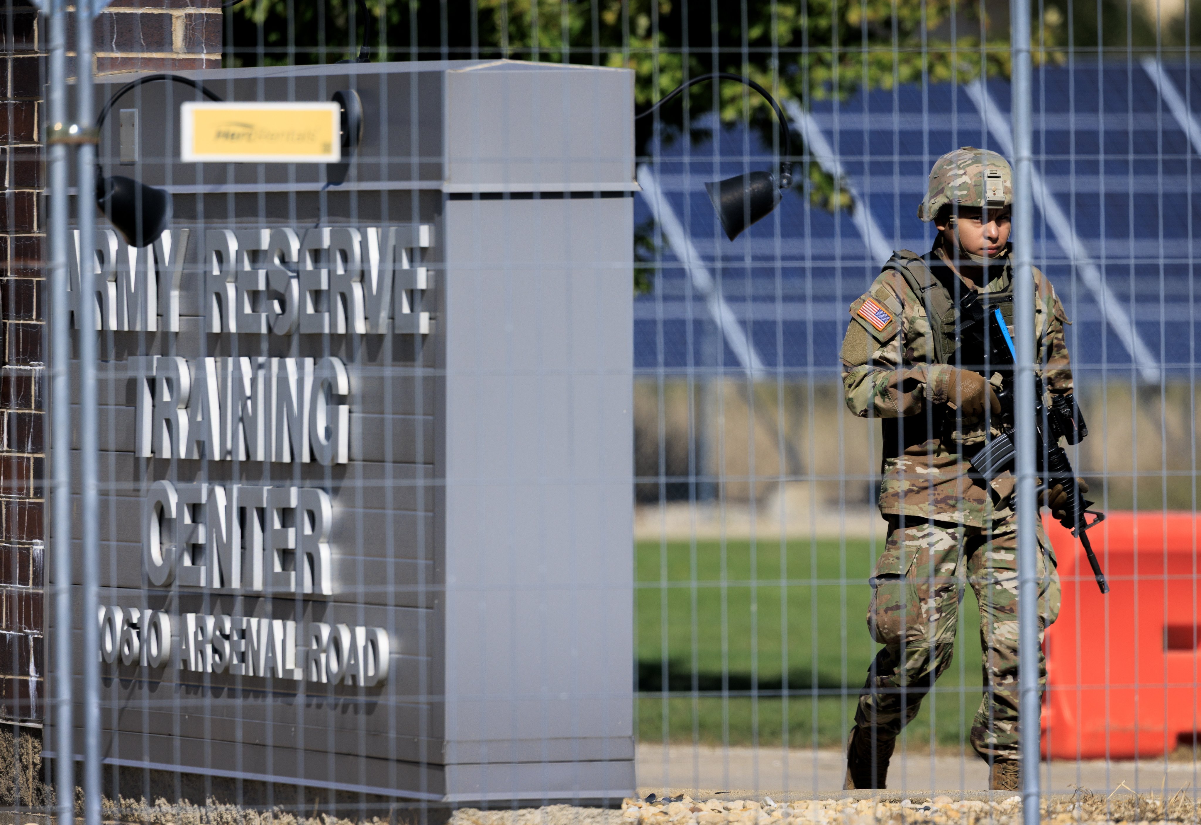A service member in National Guard uniform patrols at the US Army Reserve Centre in Elwood, Illinois, on Thursday. Photo: EPA
