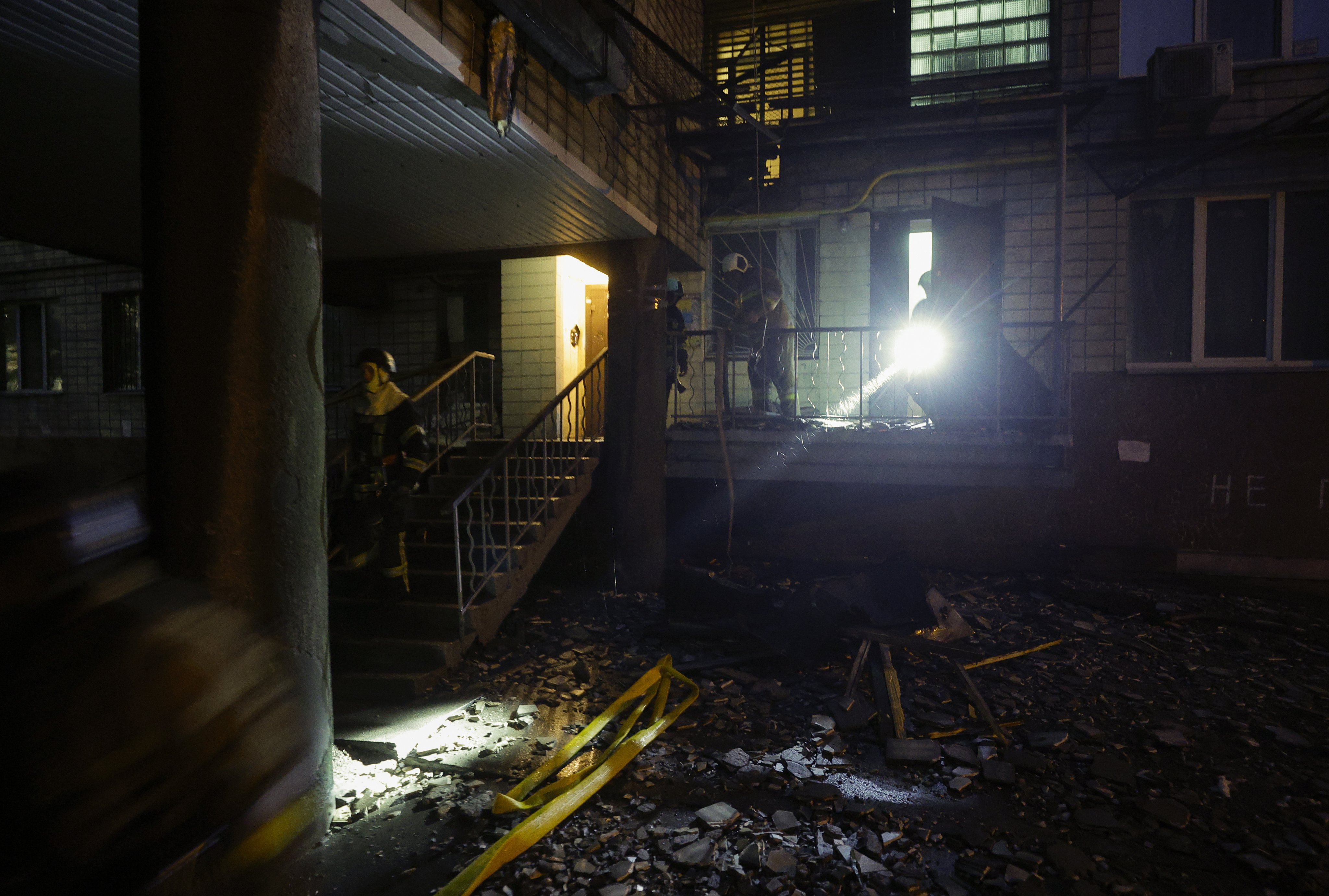 Crews work at the site of a Russian strike on a residential building in Kyiv, Ukraine on Friday. Photo: EPA