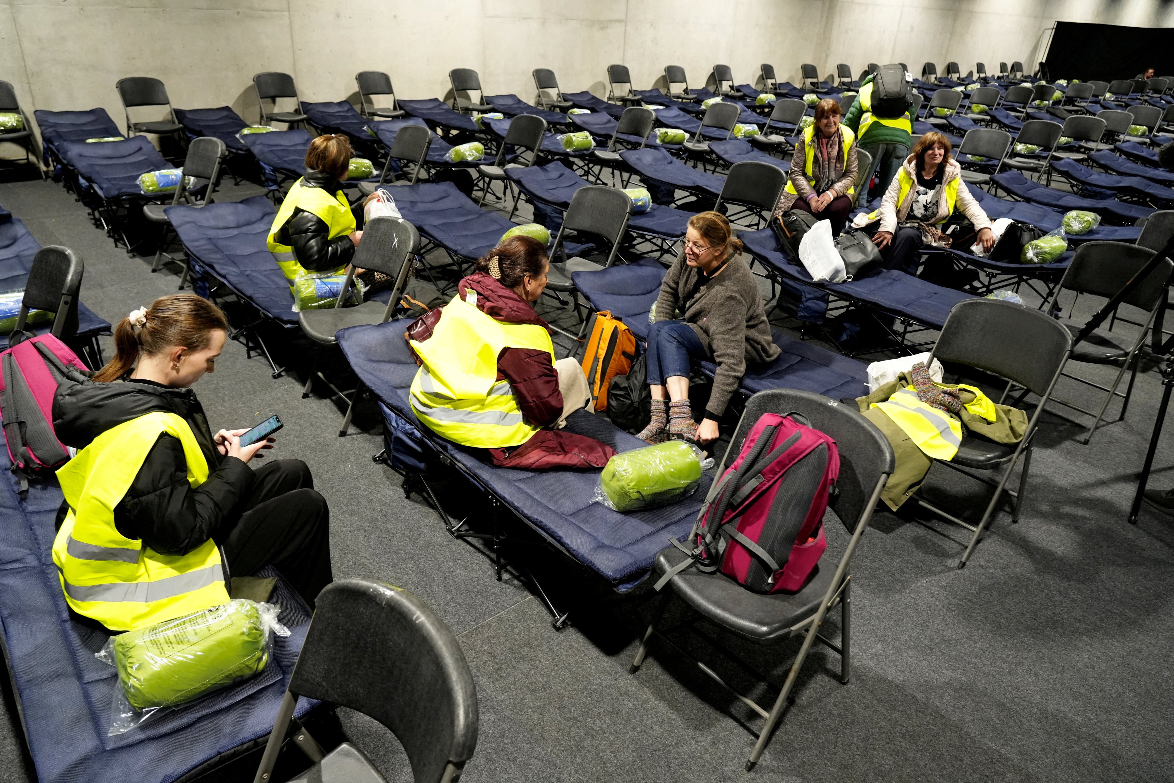 Volunteers in the evacuation centre set up in the athletics hall in Kaunas, Lithuania. Photo: Reuters