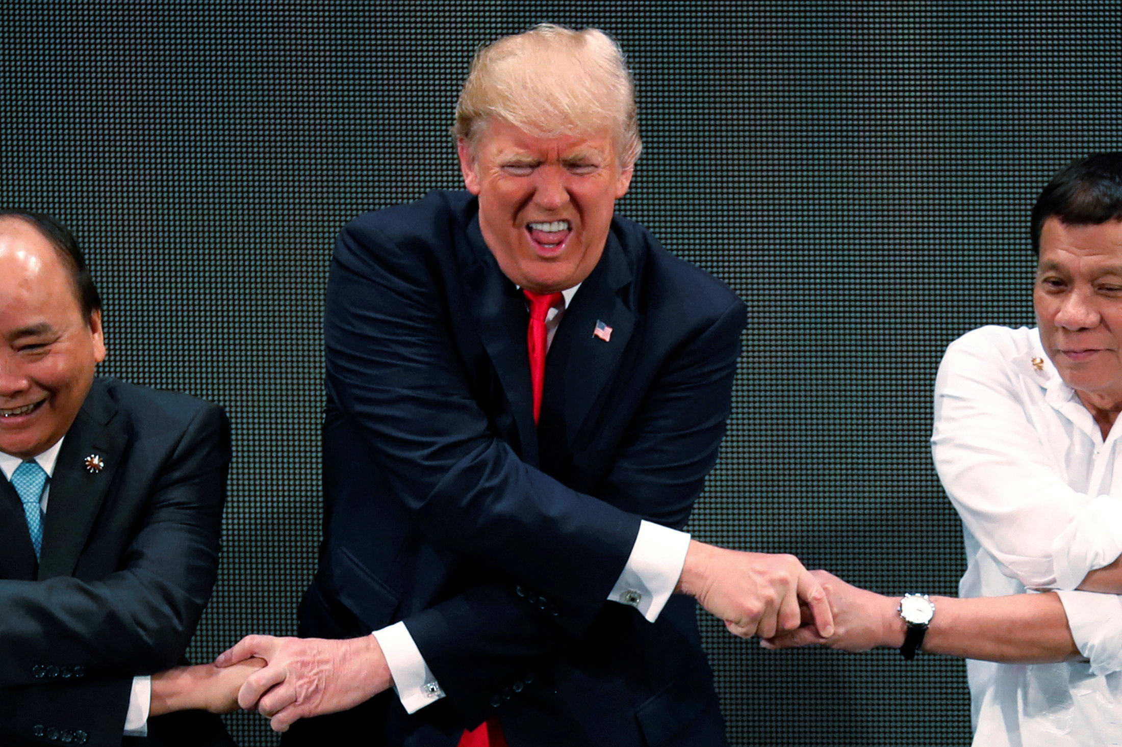 US President Donald Trump attempts the Asean handshake in 2017, the only previous occasion he attended one of the bloc’s summits. Photo: Reuters
