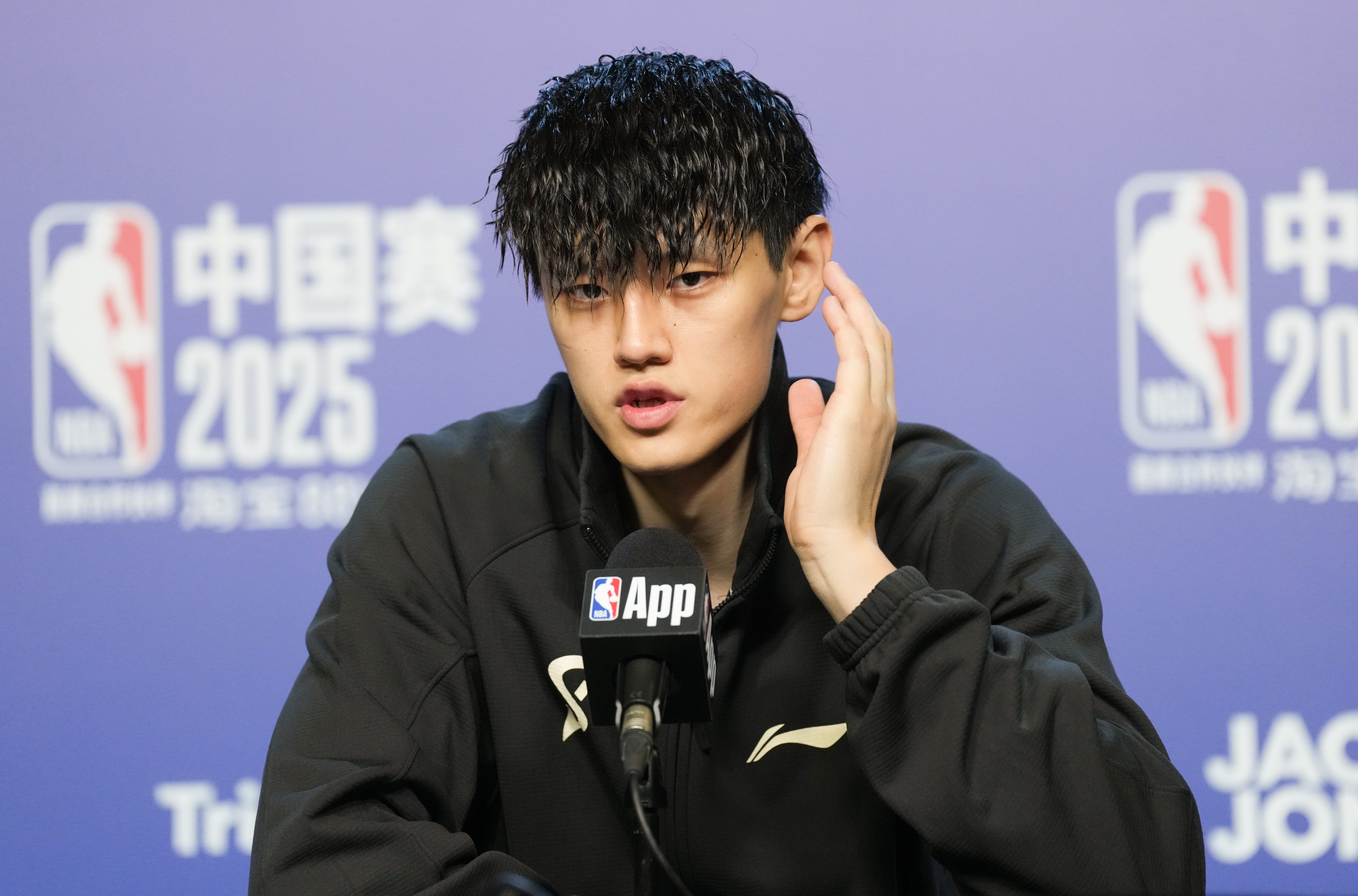 Brooklyn Nets player Zeng Fanbo speaks to the media after making his debut against the Phoenix Suns in Macau. Photo: Karma Lo