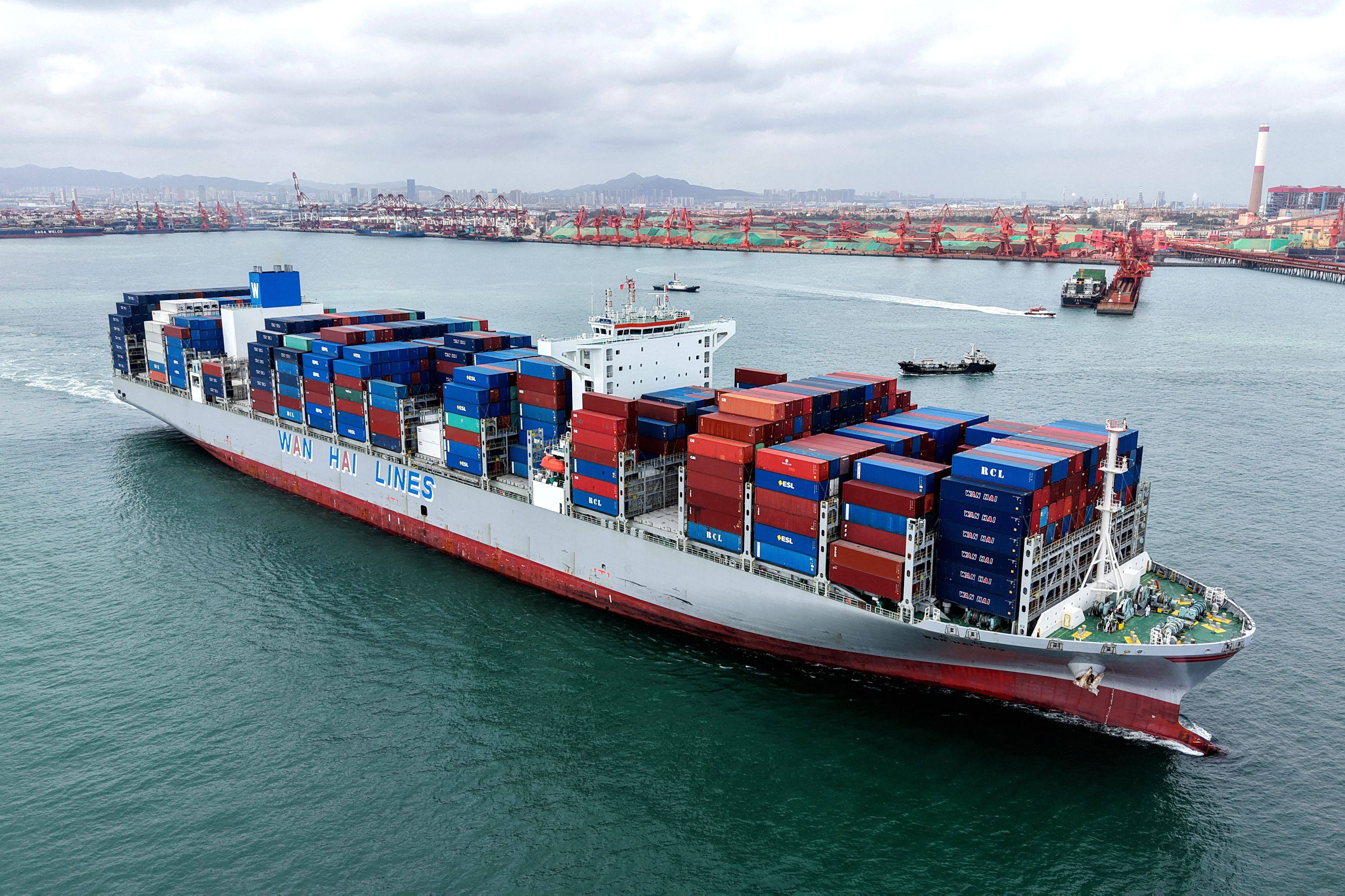 A container ship at the port in Qingdao, in eastern China. US President Donald Trump has announced an additional 100 per cent tariff on China, reigniting his trade war after Beijing imposed export curbs on rare earth materials. Photo: AFP