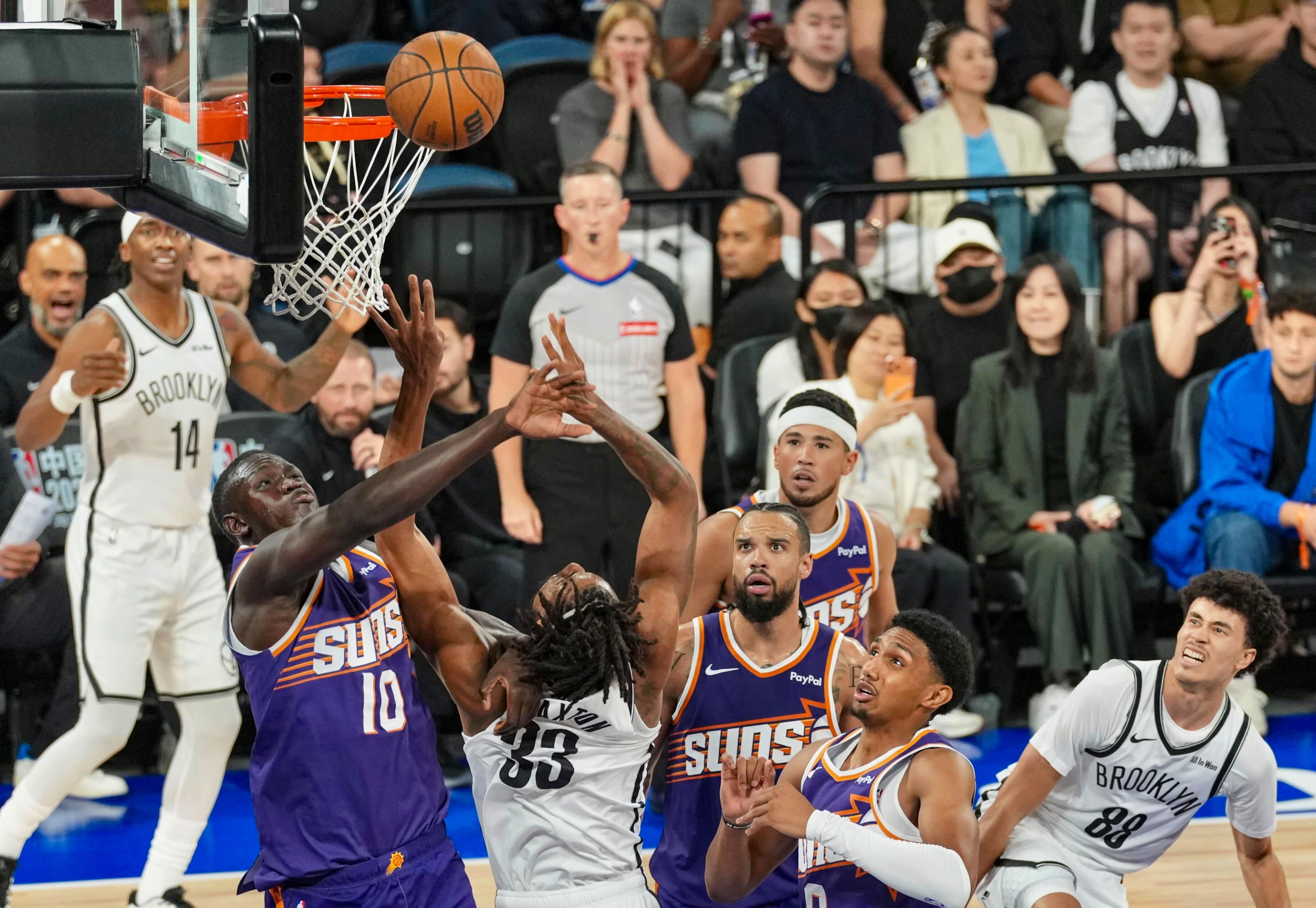 Phoenix Suns’ Khaman Maluach (left) jostling with Brooklyn Nets’ Nic Claxton under the net in their match at the The Venetian Arena, Macau. Photo: Karma Lo