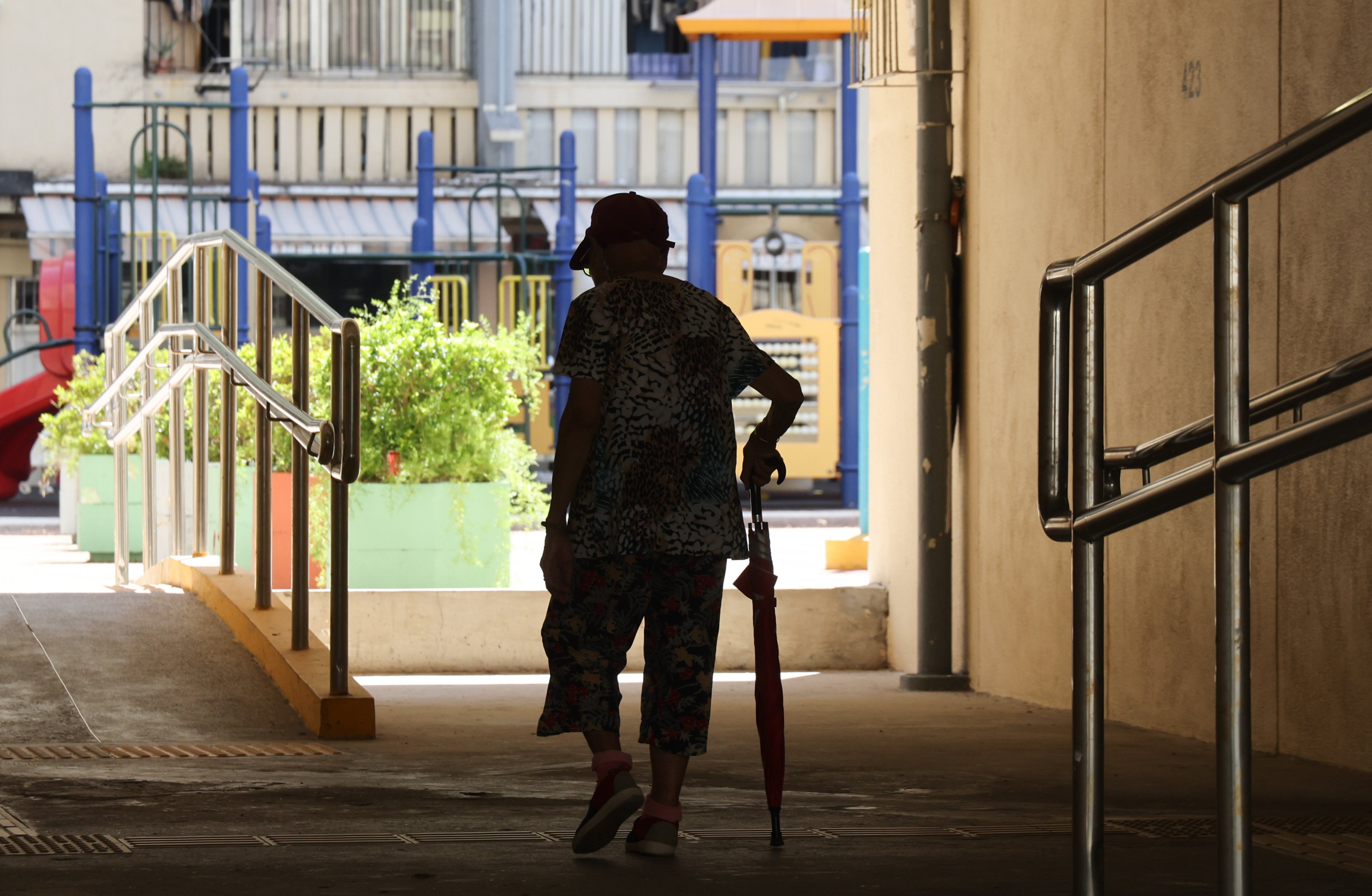 An elderly person walks through Oi Man Estate in Ho Man Tin on October 10. Social welfare authorities have pledged to improve their services for carers by removing unnecessary checks on their background and medical history, adding that any care homes failing to do it would receive a warning. Photo: Jelly Tse