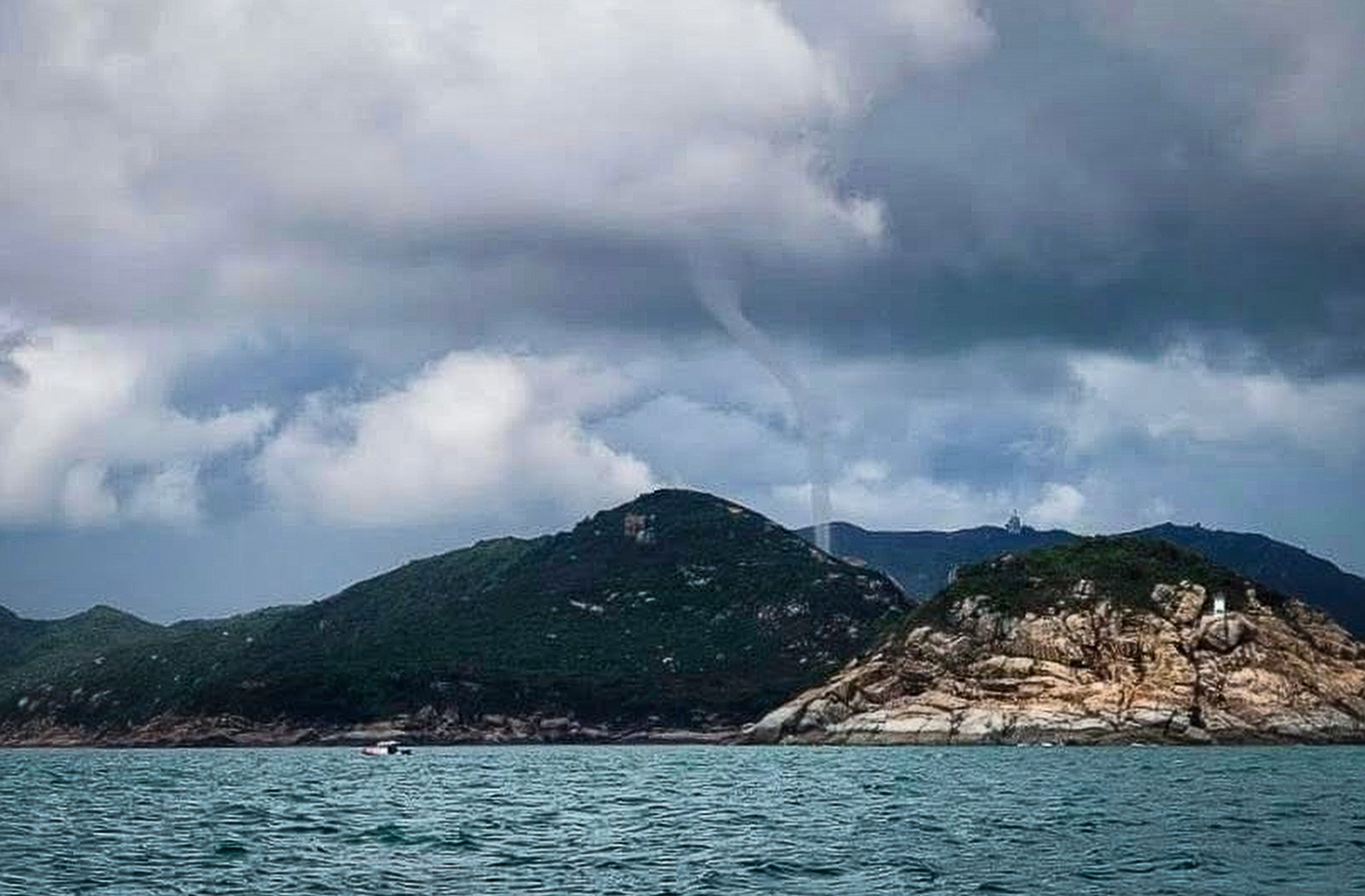 The waterspout was spotted off in the sea off Lamma Island around 1pm on Sunday. Photo: handout