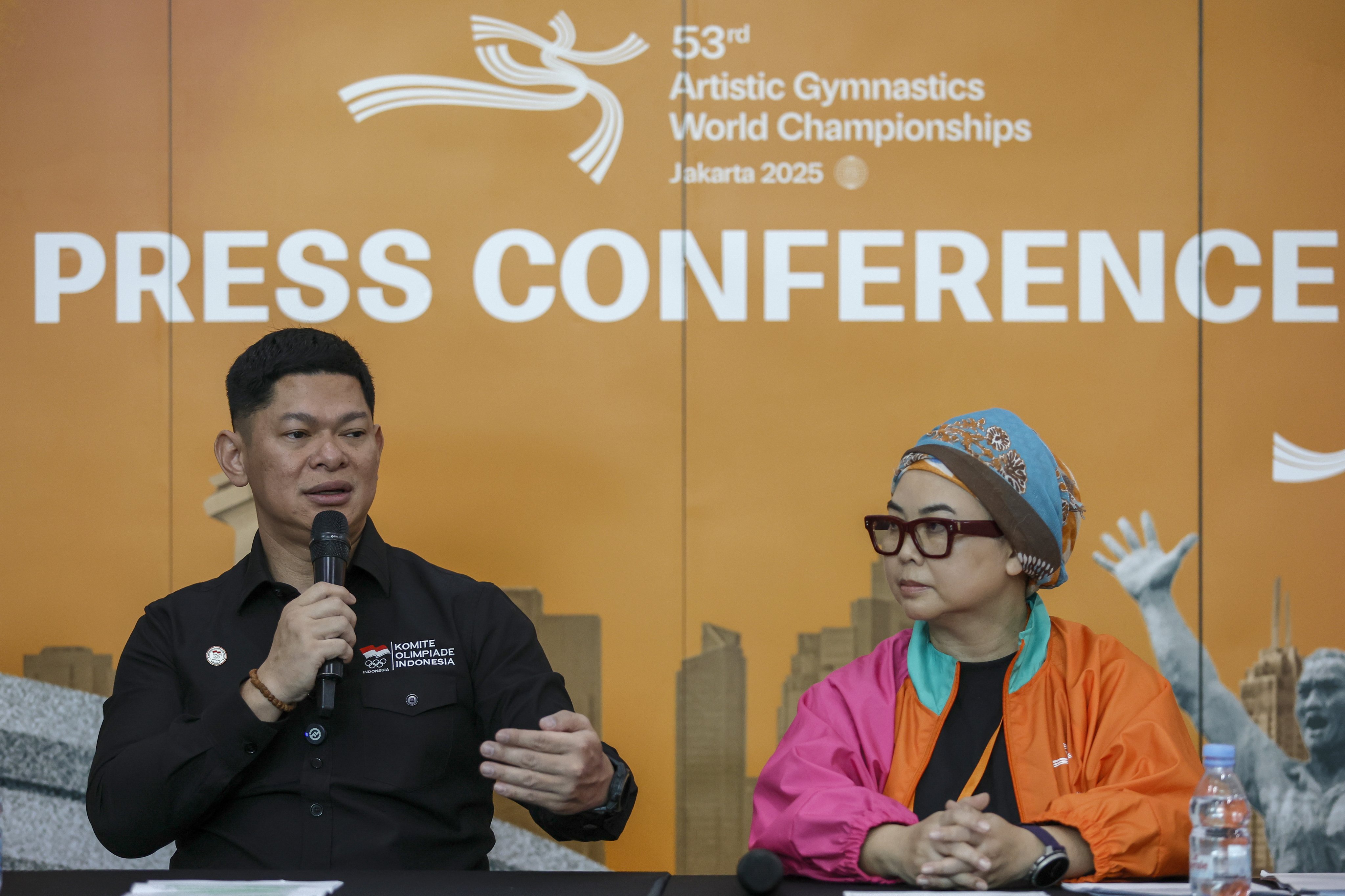 President of Indonesian National Olympics Committee Raja Sapta Oktohari (left) speaks next to the president of Indonesian Gymnastic Federation Ita Yuliati ahead of the 53th Artistic Gymnastics World Championships. Photo:  EPA
