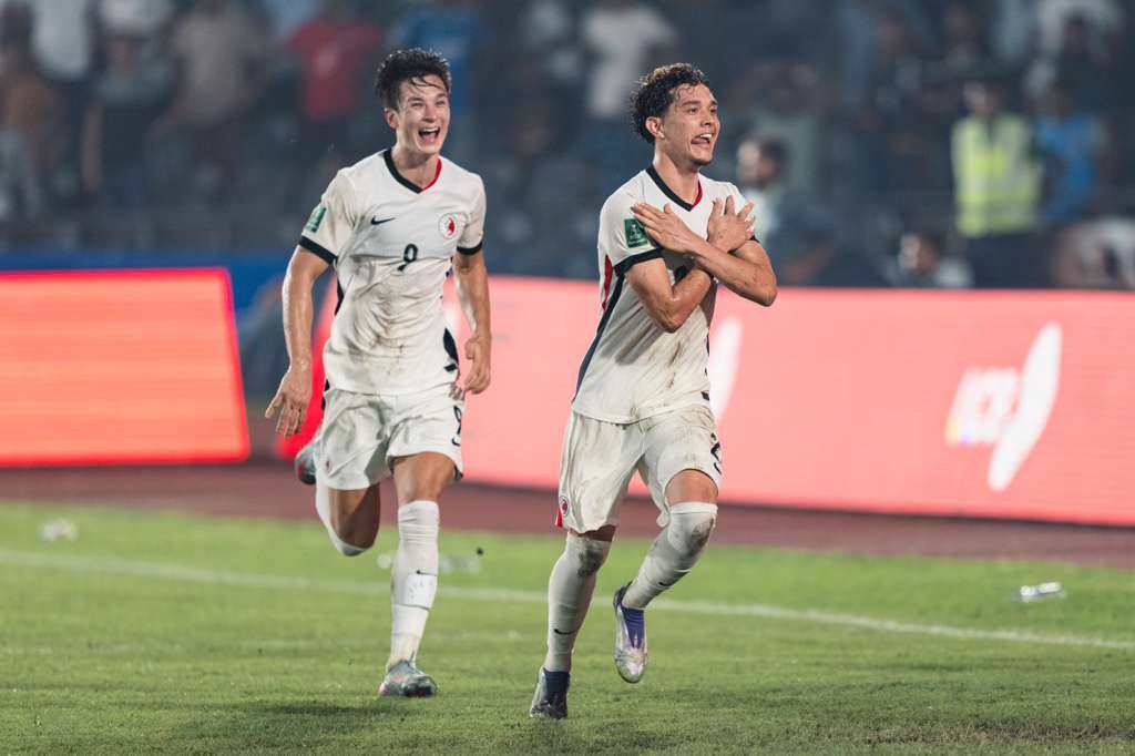 A gleeful Matt Orr (left) chases Raphael Merkies after the winger’s winner in Bangladesh. Photo: HKFA