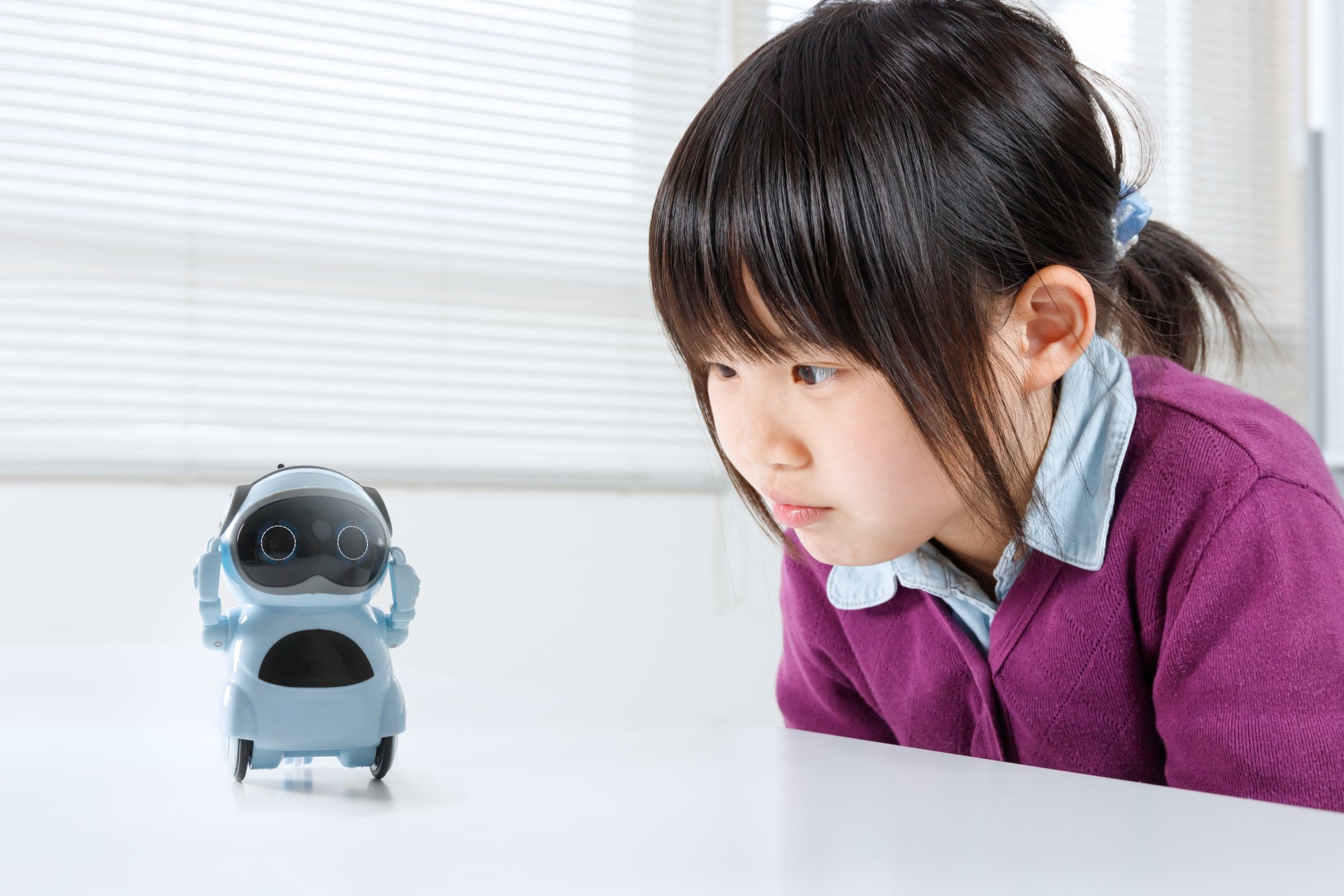 In a quiet classroom in Japan, a young girl sits intently, her eyes fixed on her small AI tutor. Photo: Getty Images In a quiet classroom in Japan, a young girl sits intently, her eyes fixed on her small AI tutor. Photo: Getty Images