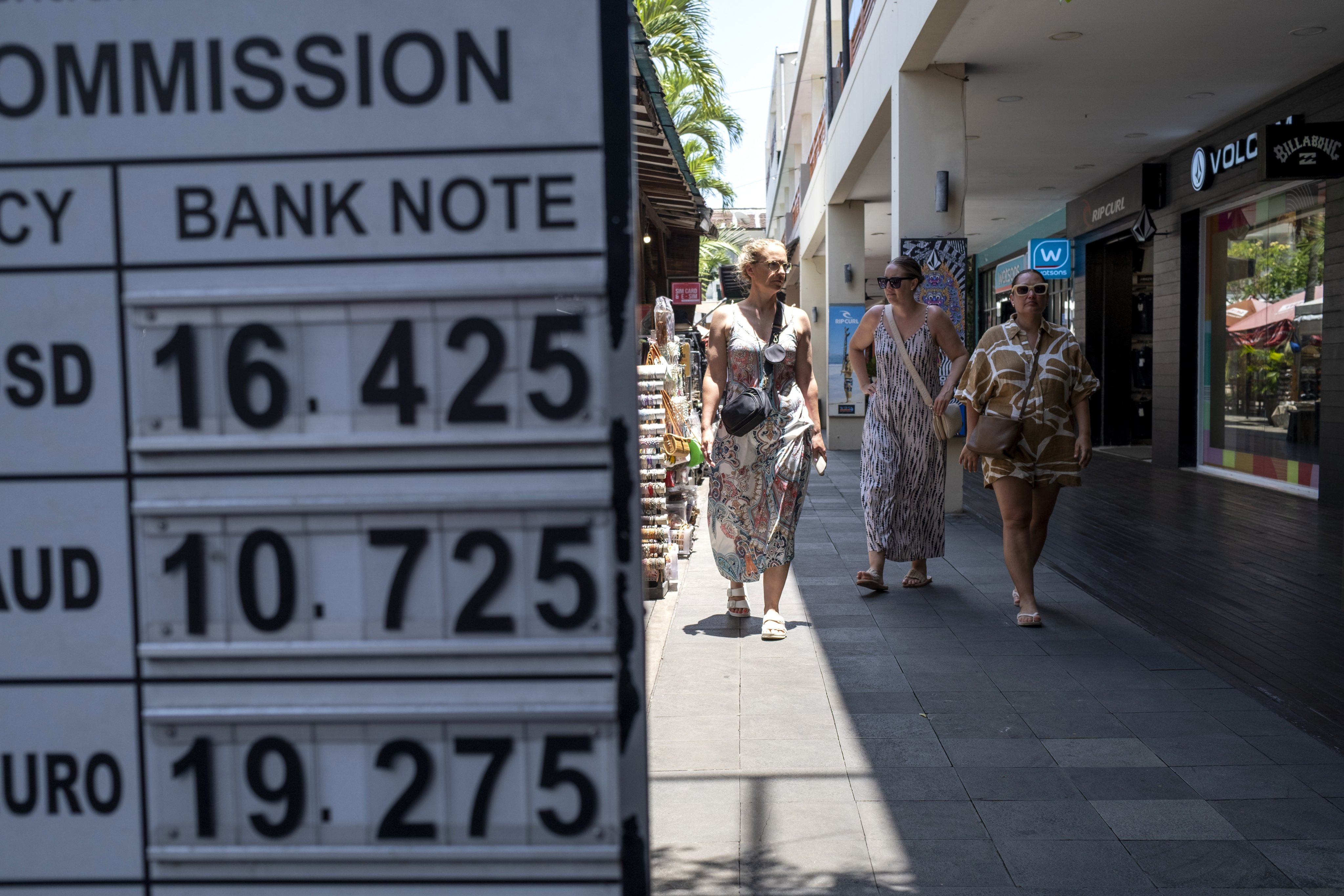 Tourists explore a shopping area in Seminyak on the west coast of Bali. Photo: EPA