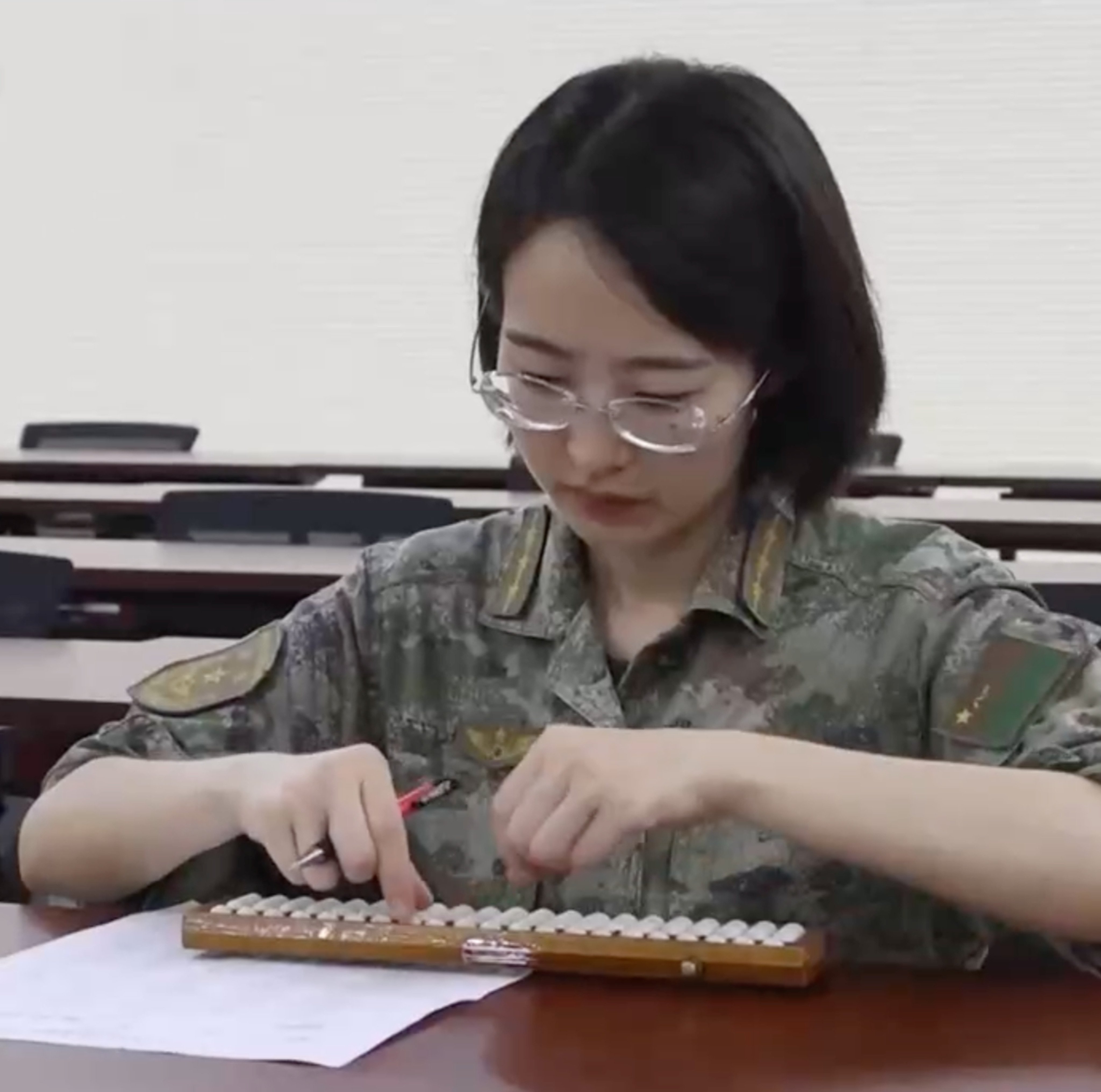 Chinese state media showcases the skills of  Captain Xu Meiduo, who teaches soldiers how to use the abacus and other traditional mathematical techniques. Photo: CCTV