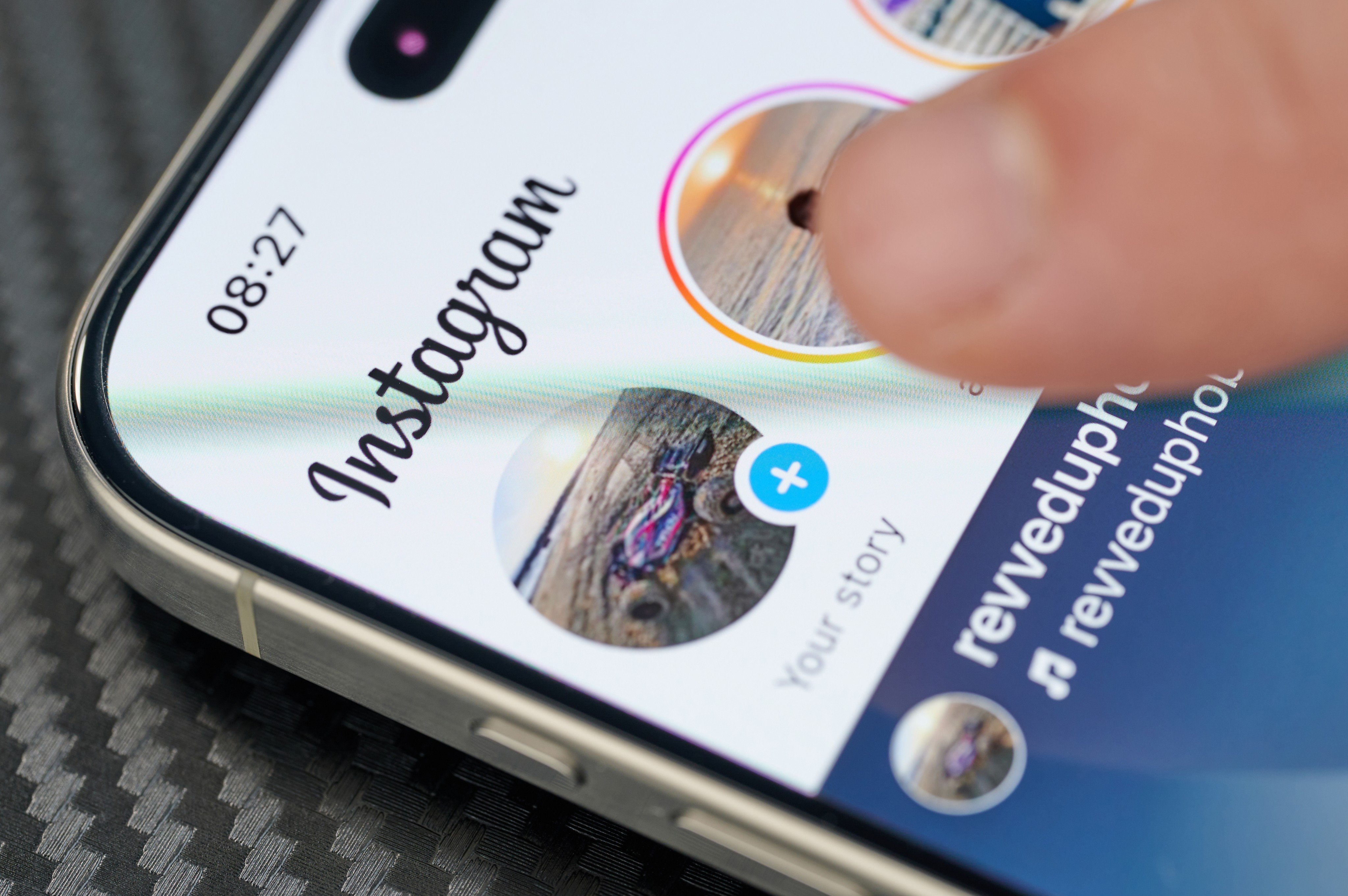 A social media user watching stories on Instagram. Photo: Shutterstock