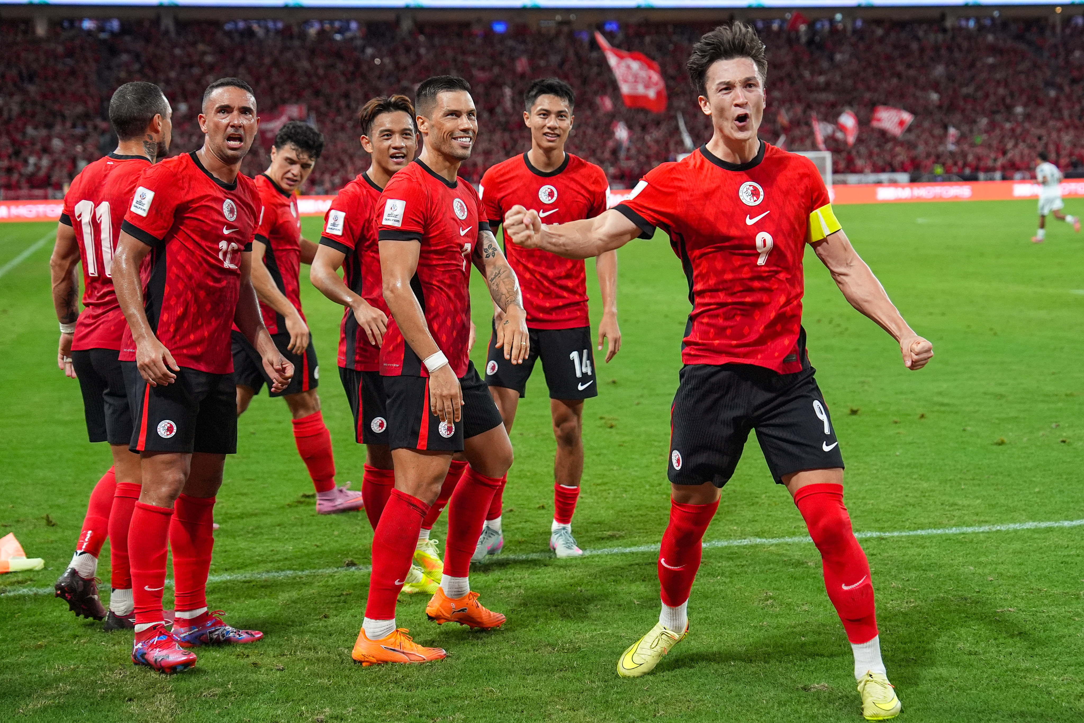 Hong Kong’s Matt Orr (right) celebrates after putting his side ahead against Bangladesh. Photo: Elson Li
