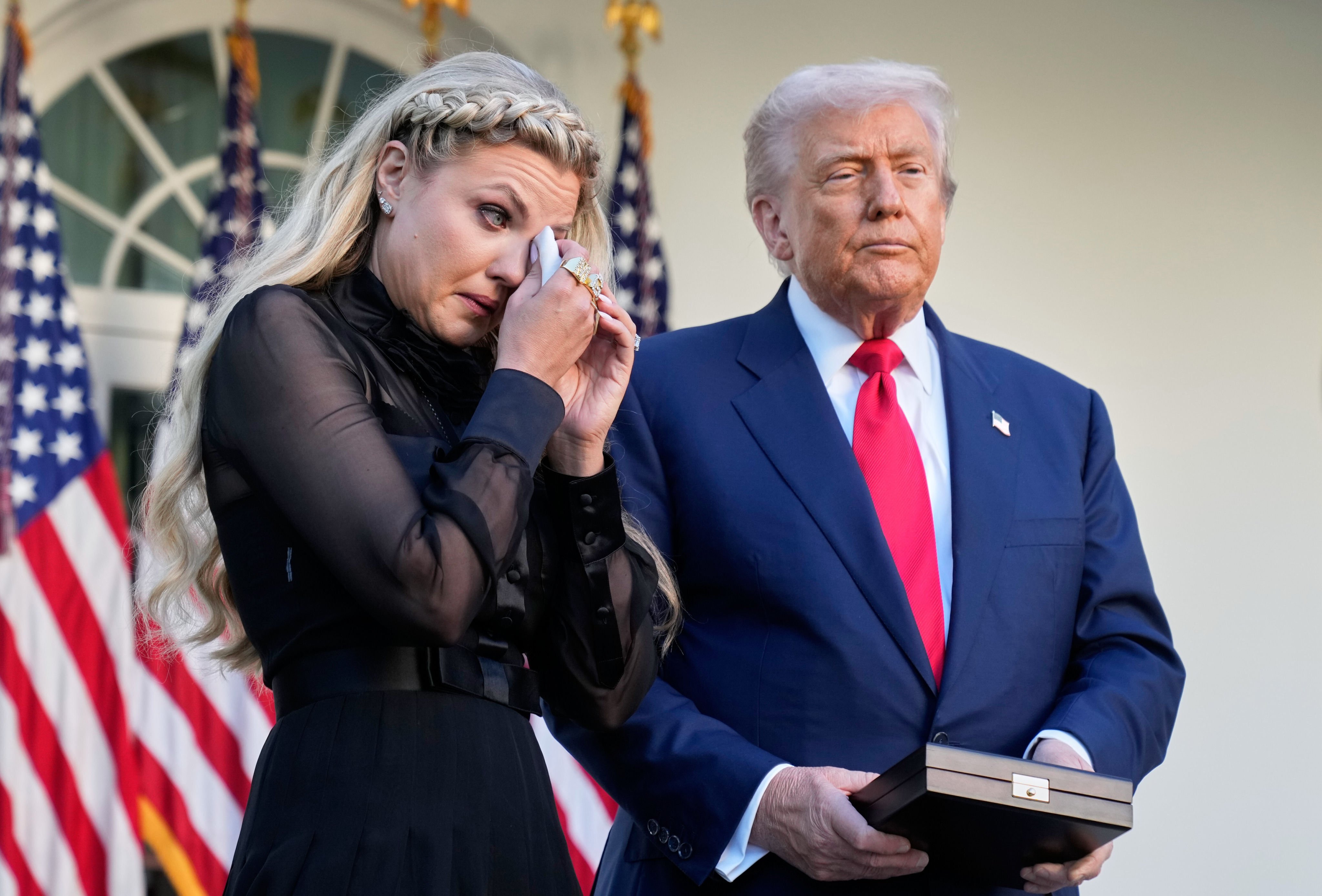 Erika Kirk wipes her eyes as US President Donald Trump prepares to posthumously awards the Presidential Medal of Freedom to her late husband Charlie Kirk in the Rose Garden of the White House on Tuesday. Photo: AP