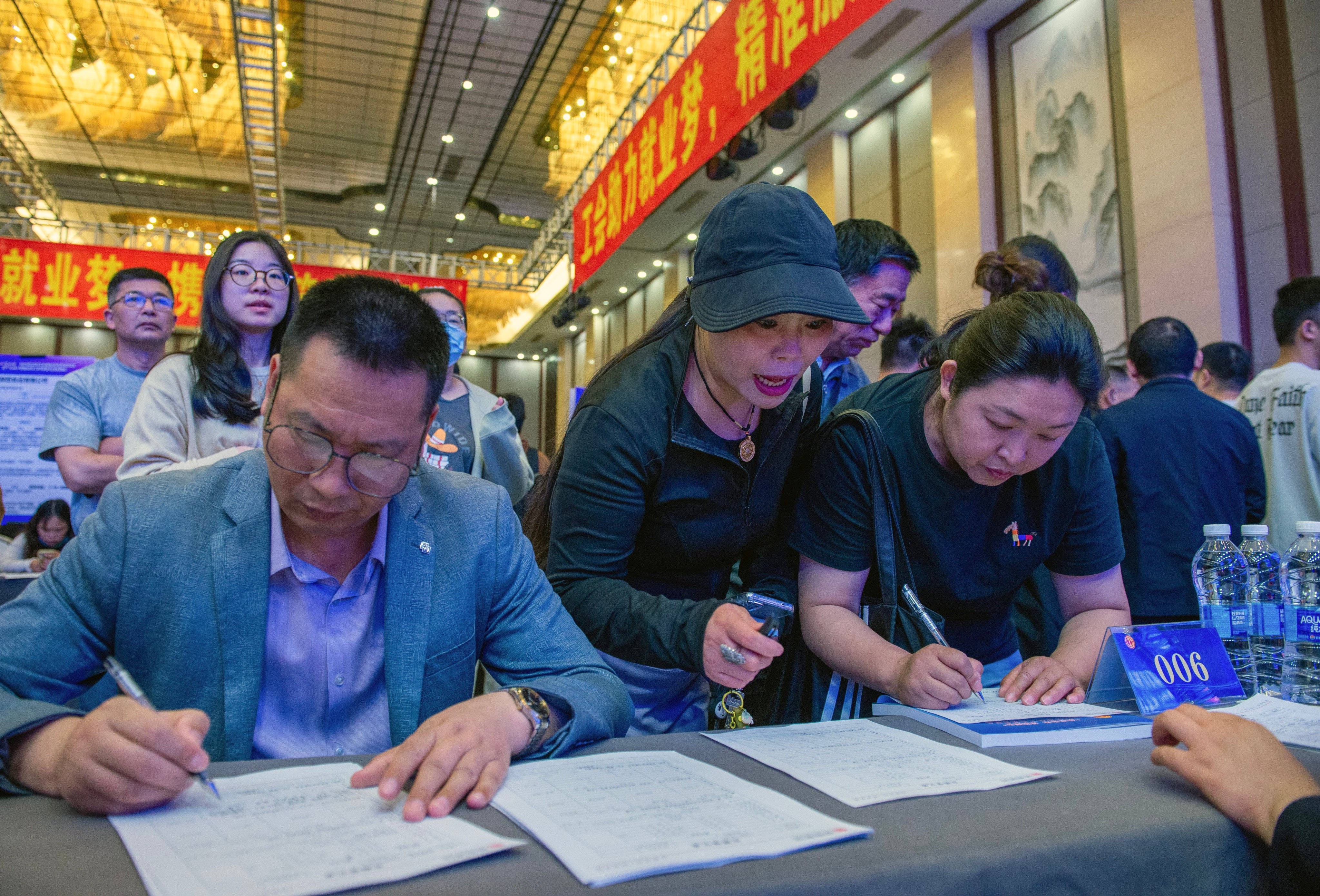 Jobseekers attend a career fair in eastern China. Chinese workers have long complained of a “curse of 35”, where people struggle to get hired after hitting their mid-30s. Photo: Getty Images