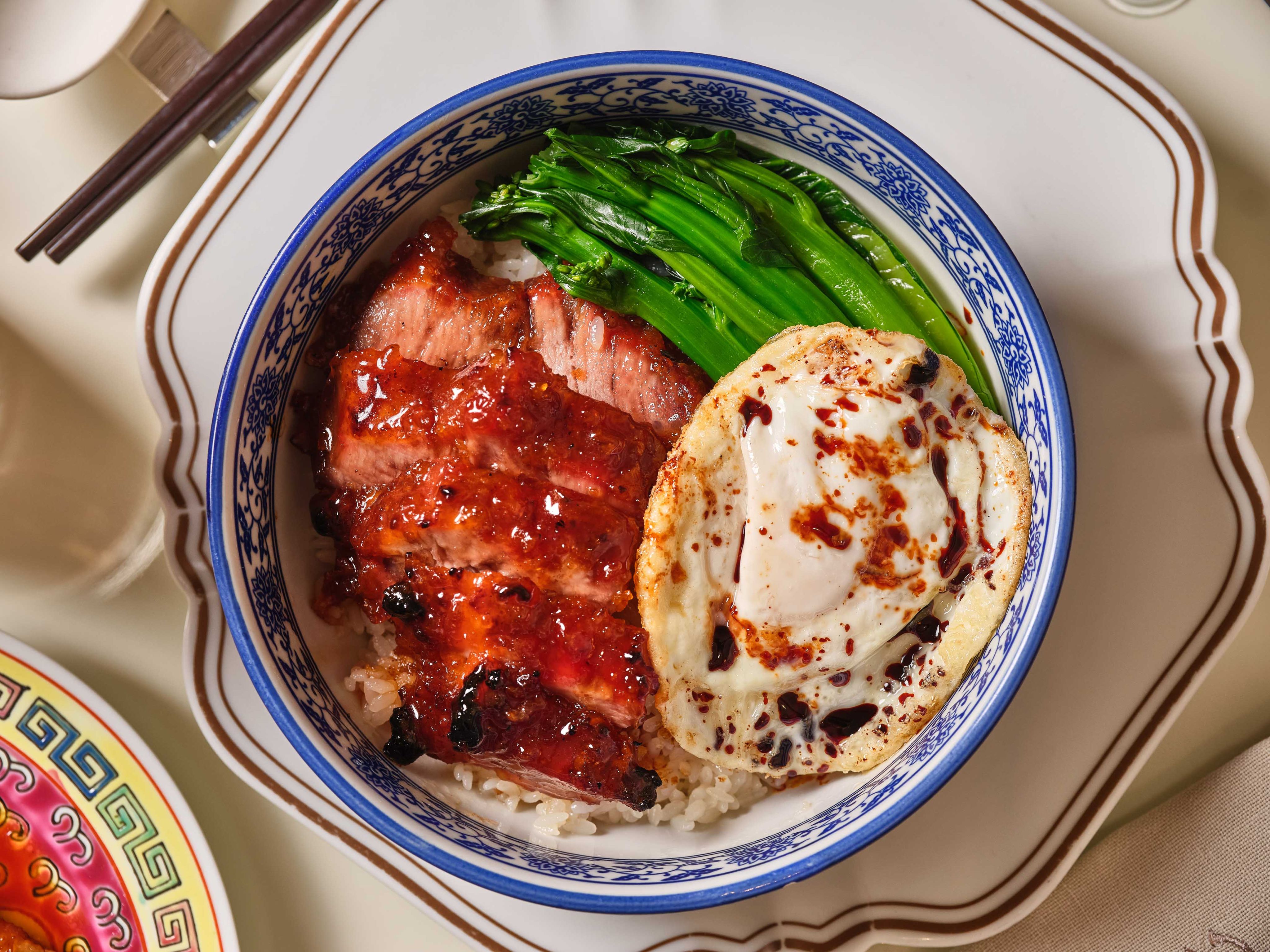 Char siu rice at Holt’s Cafe at the Rosewood Hong Kong in Hong Kong. What are runners in Hong Kong loading up on to maintain their carb intake?