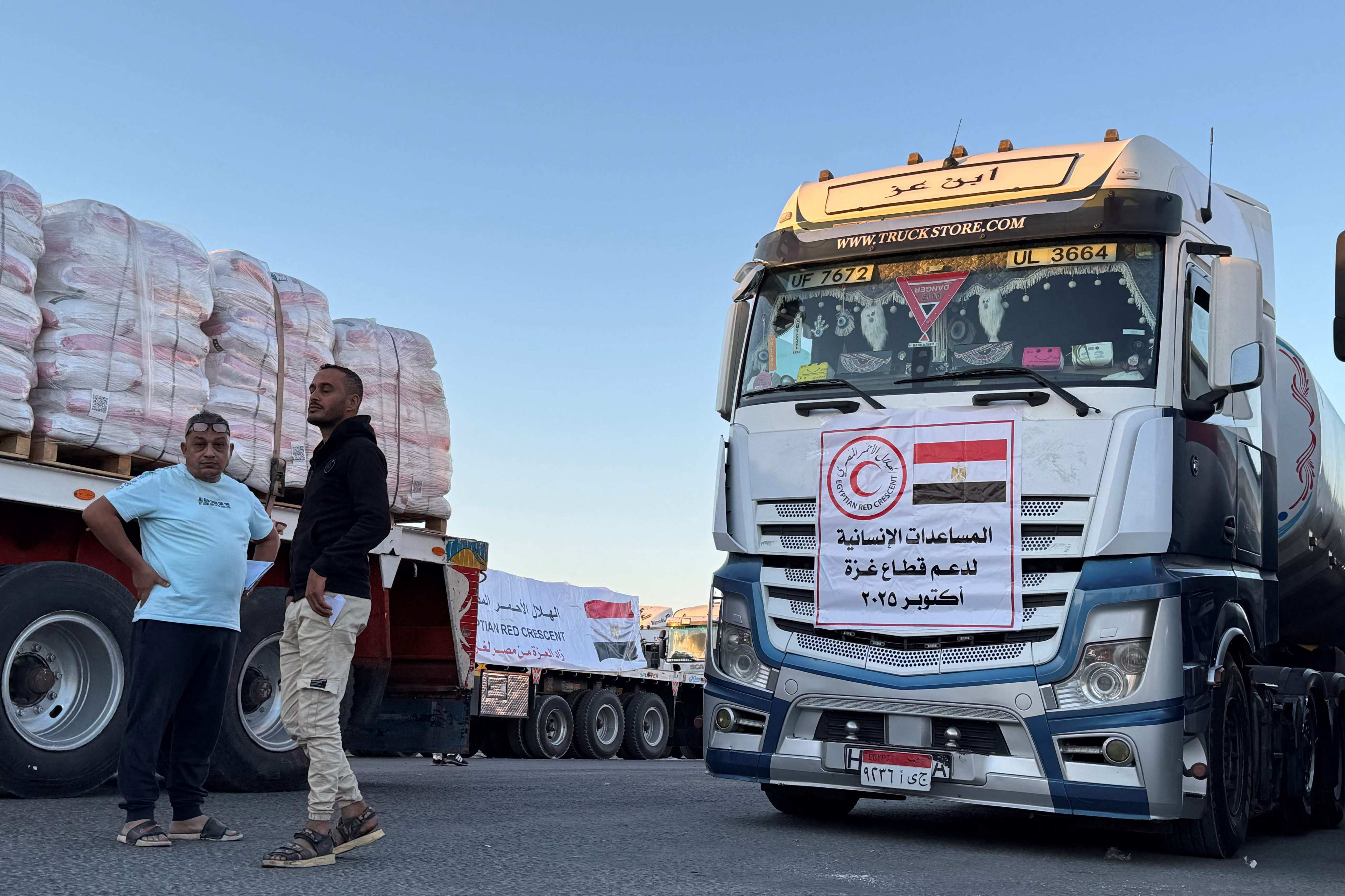 Trucks loaded with humanitarian aid wait on the Egyptian side of the Rafah crossing, before being allowed into the Gaza Strip on Wednesday. Photo: AFP