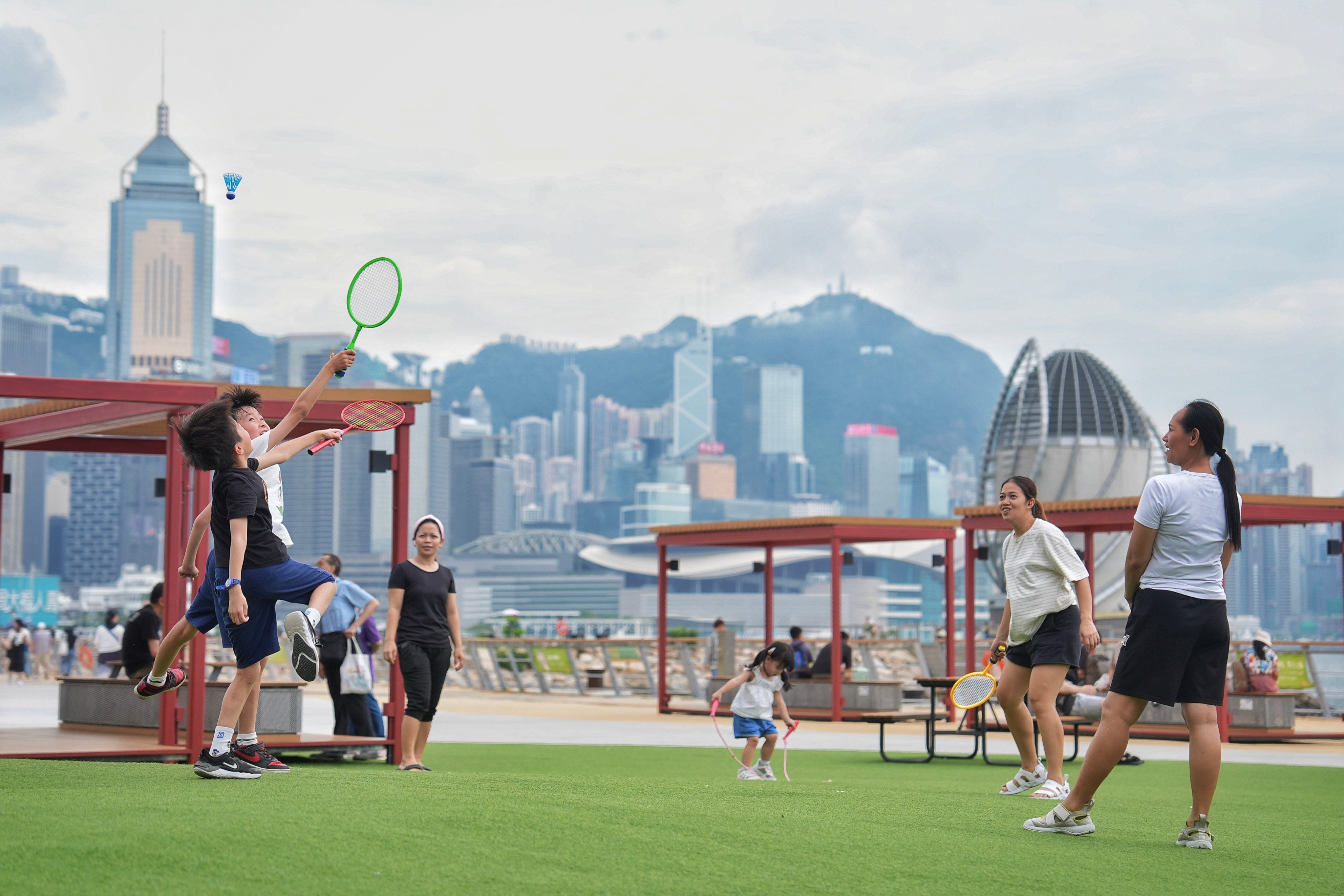Children play with their carers at the East Coast Park Precinct in Fortress Hill on July 11. Migrant domestic workers make up 9.6 per cent of Hong Kong’s labour force and have a vital role in caregiving. Photo: Elson Li