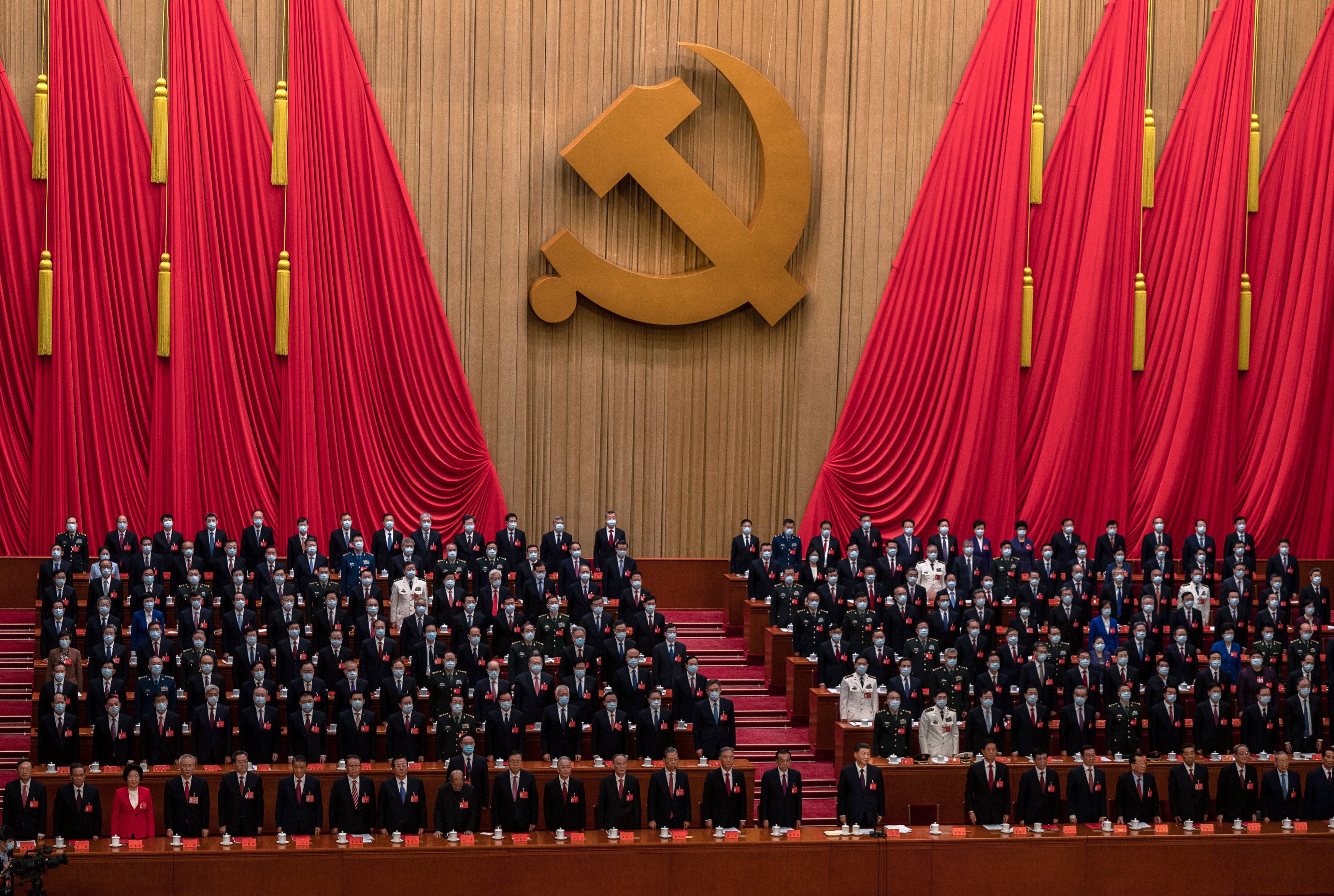 President Xi Jinping and senior members of the government stand for the national anthem at the end of the closing session of the 20th National Congress of the Communist Party at The Great Hall of People on October 22, 2022, in Beijing. Photo: Getty Images