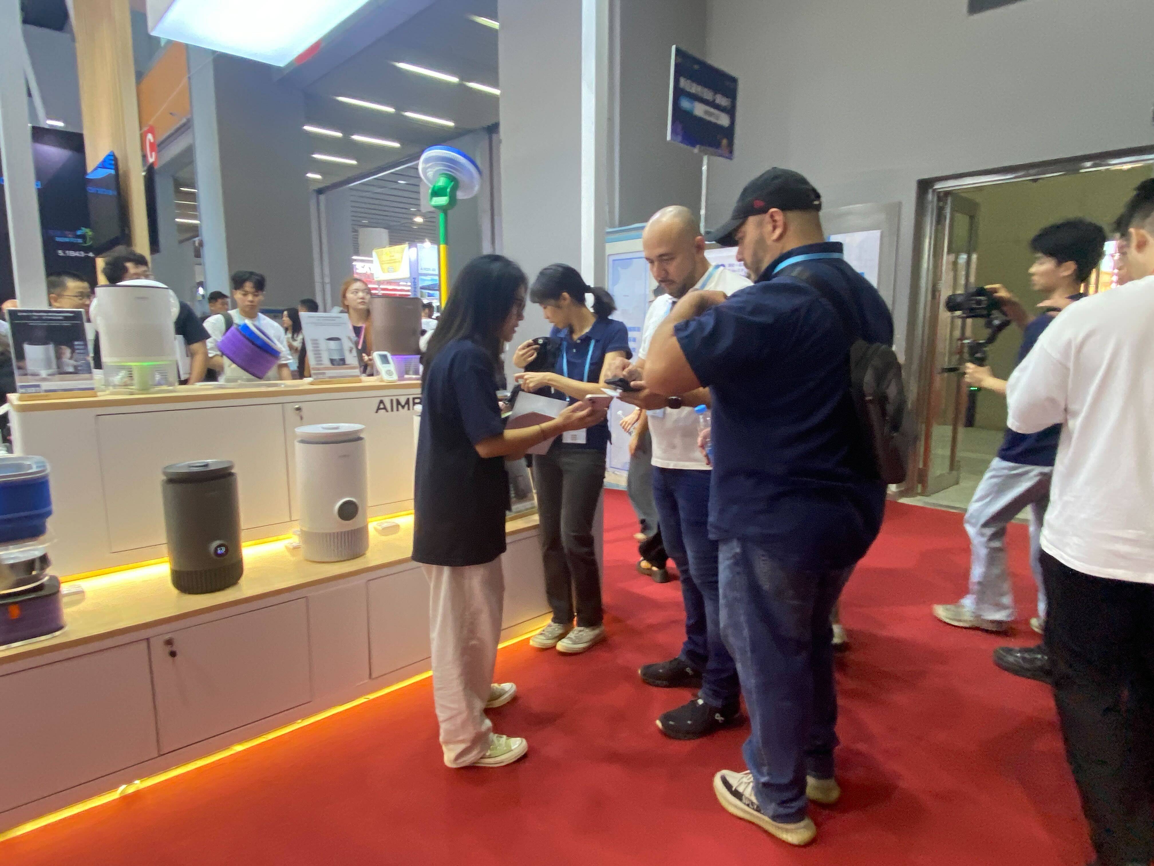 Buyers visit a booth at the Canton Fair, in the southern Chinese city of Guangzhou, on October 15. US-China tensions have cast a shadow over the event, despite a rise in visitors. Photo: He Huifeng