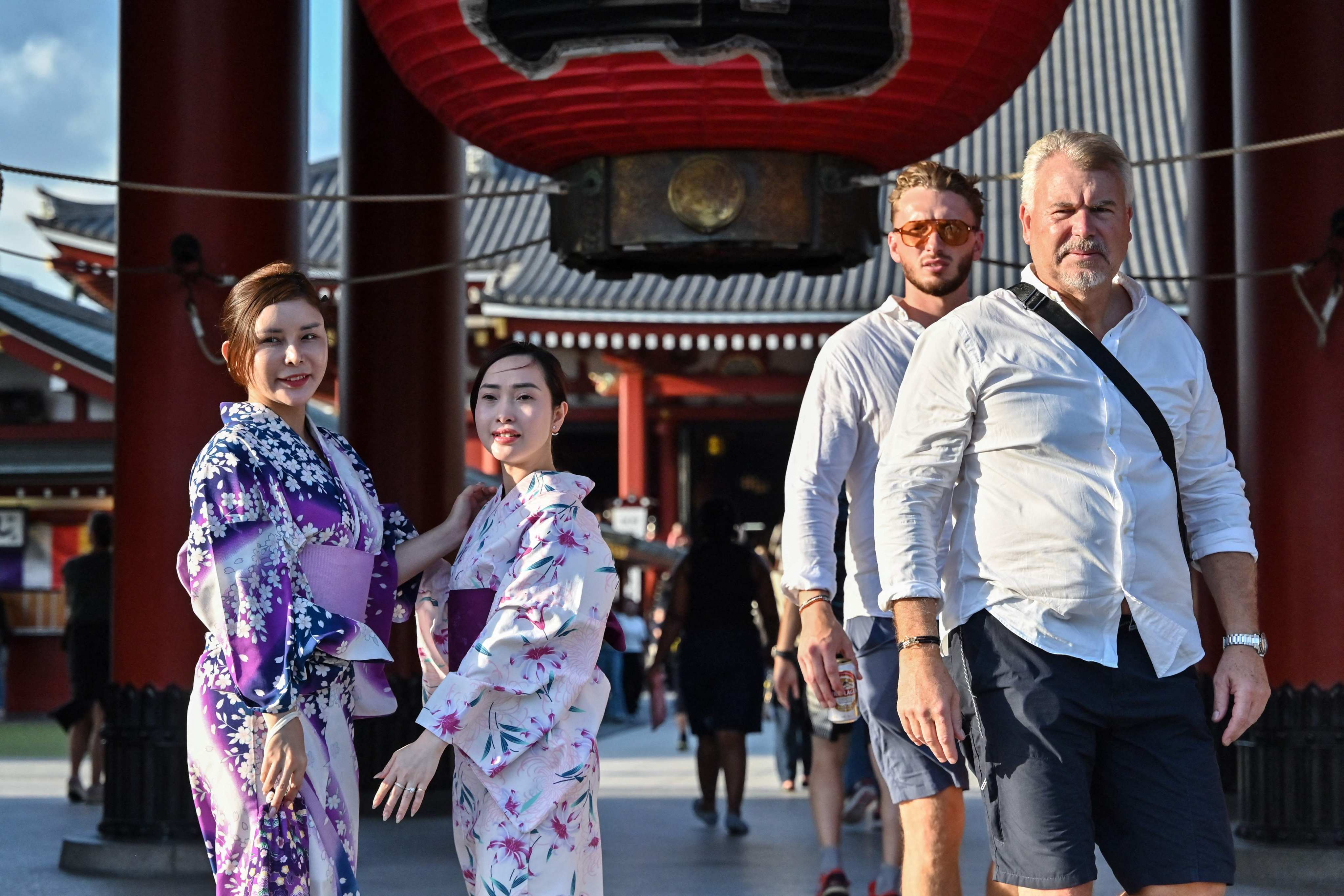 Women dressed in kimonos pose for a photo in Tokyo. It is inconceivable for any new ruling coalition to allow Japan to fall back into old deflationary patterns, according to Fidelity. Photo: AFP