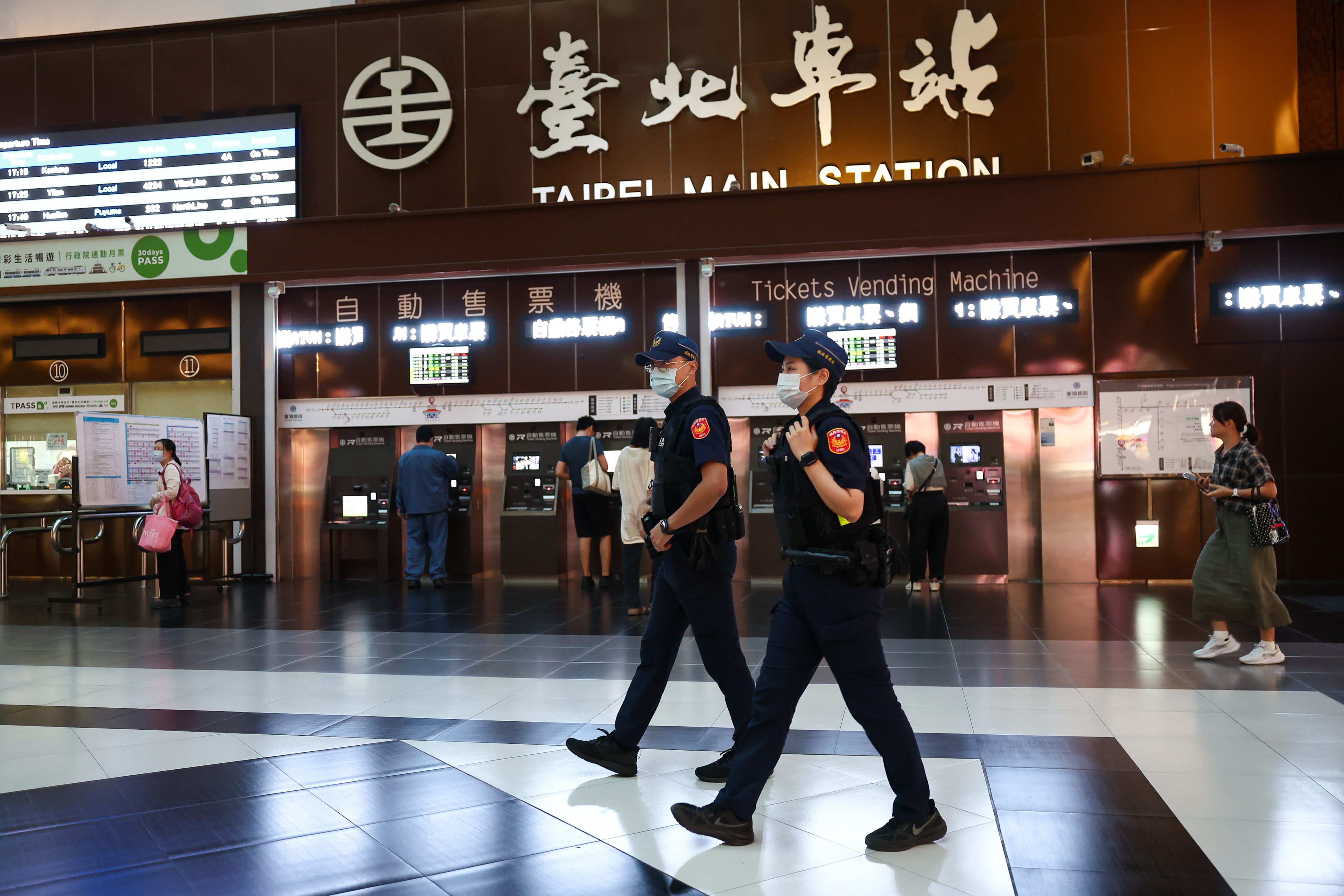 Police officers patrol Taipei Main Station as part of enhanced procedures in the wake of the assault. Photo: CNA