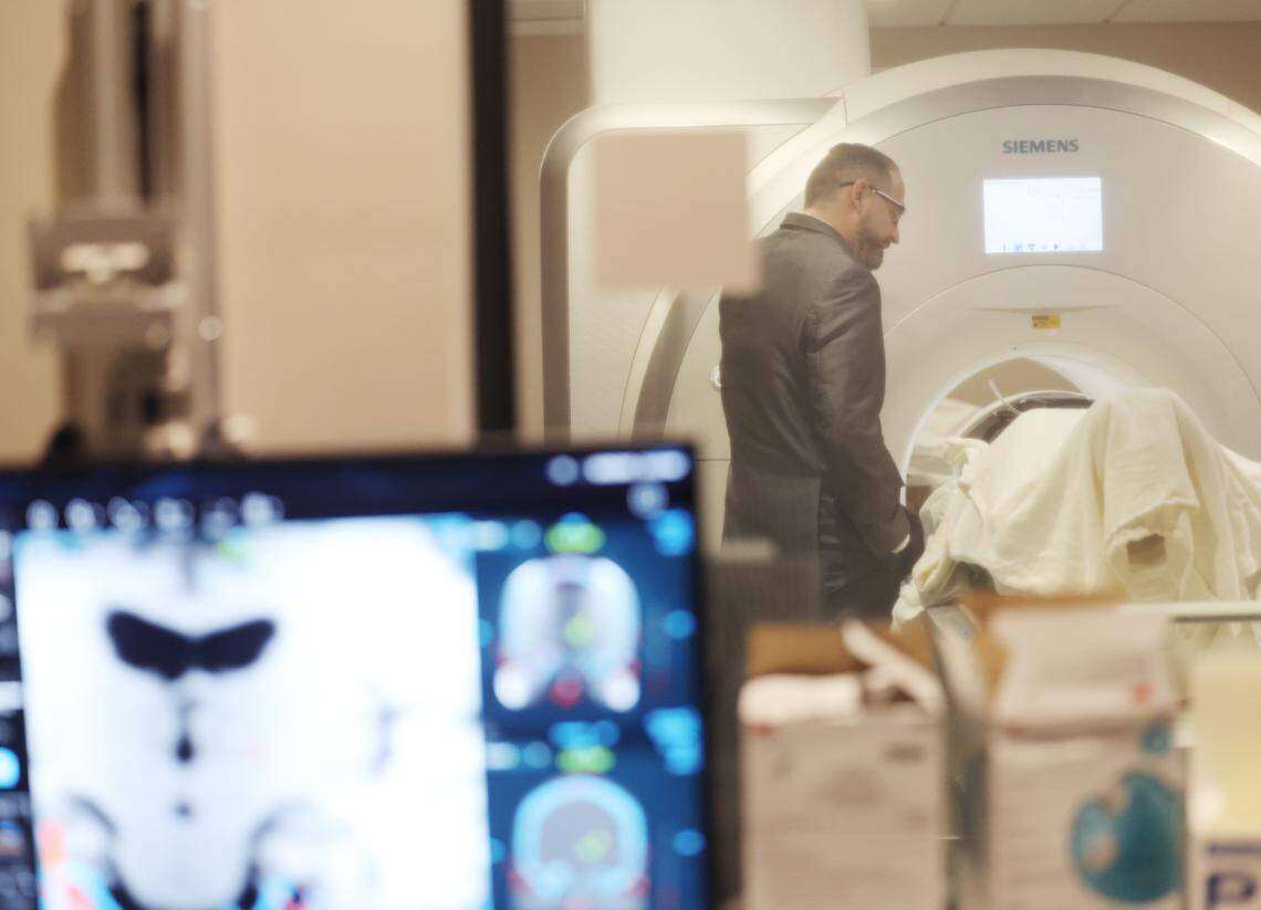 Neurosurgeon Dr Charles Munyon talks to patient Catherine Klie ahead of her incisionless brain surgery to stop her tremors at Novant Health Mint Hill Medical Center in North Carolina, in the US. Klie’s was the 709th procedure of its kind at the centre. Photo: TNS