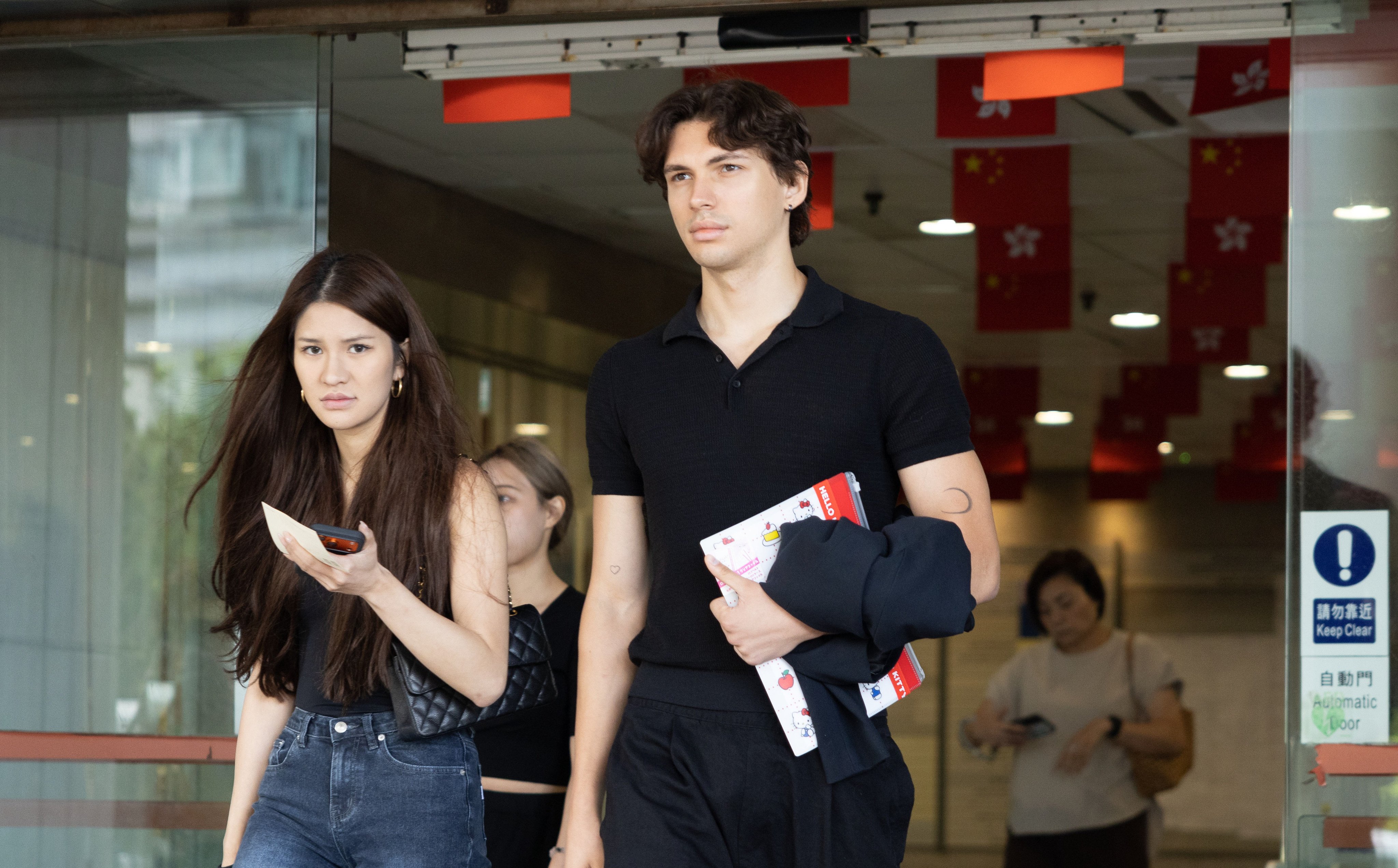 Aliaksandr Buka, right, leaves Eastern Court after being handed a suspended sentence for assaulting two police officers. Photo: Brian Wong