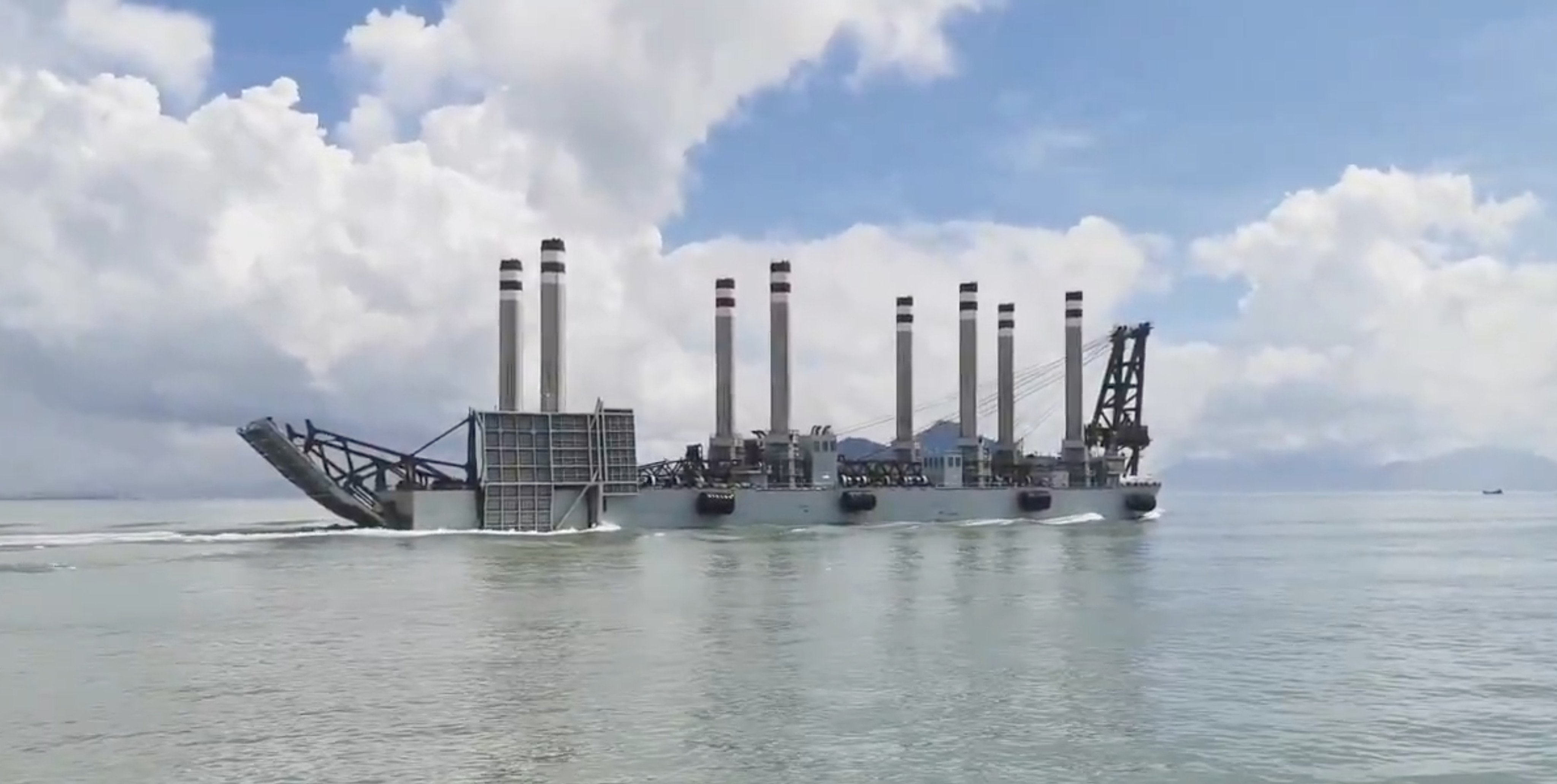 Video has emerged of the PLA’s self-propelled jack-up barge sailing in an unidentified body of water with its road ramp and signature eight struts raised. Photo: Handout