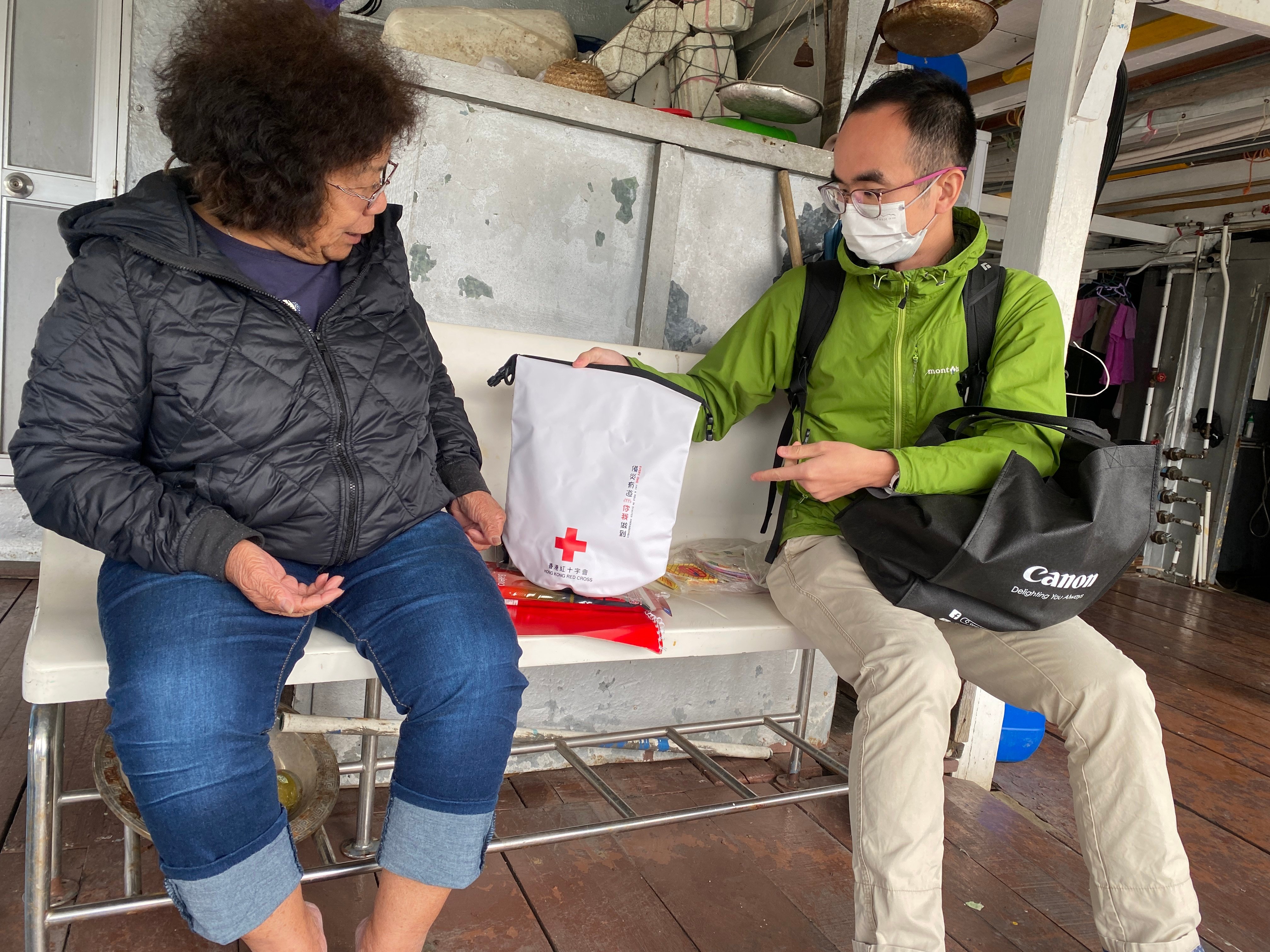 Volunteers from the Hong Kong Red Cross Local Disaster Management Team deliver emergency supplies to Tai O residents to help them prepare for extreme weather. Photo: Handout