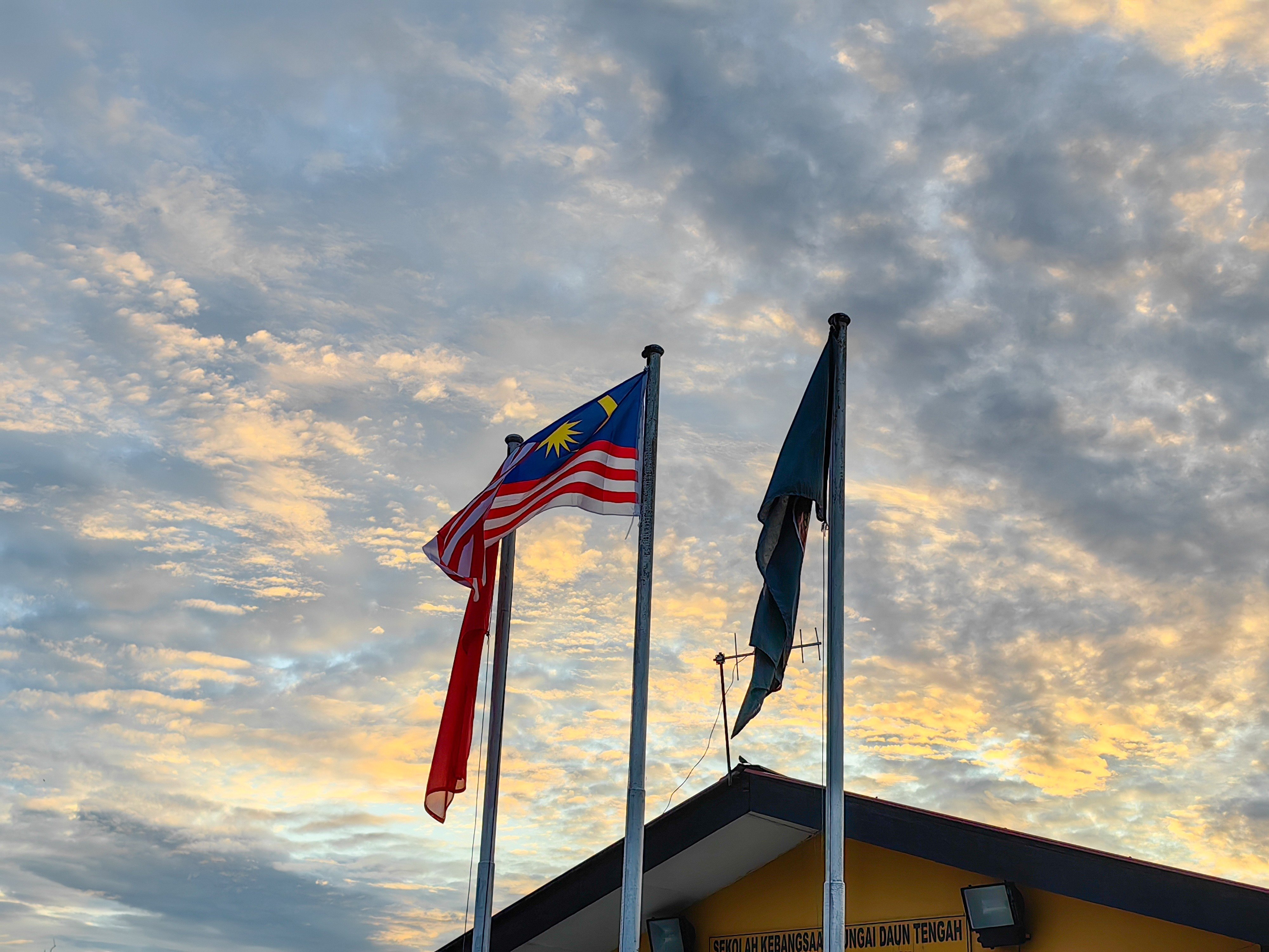 State and country flags fly from flagpoles in a school in Kedah, Malaysia. Photo: Shutterstock
