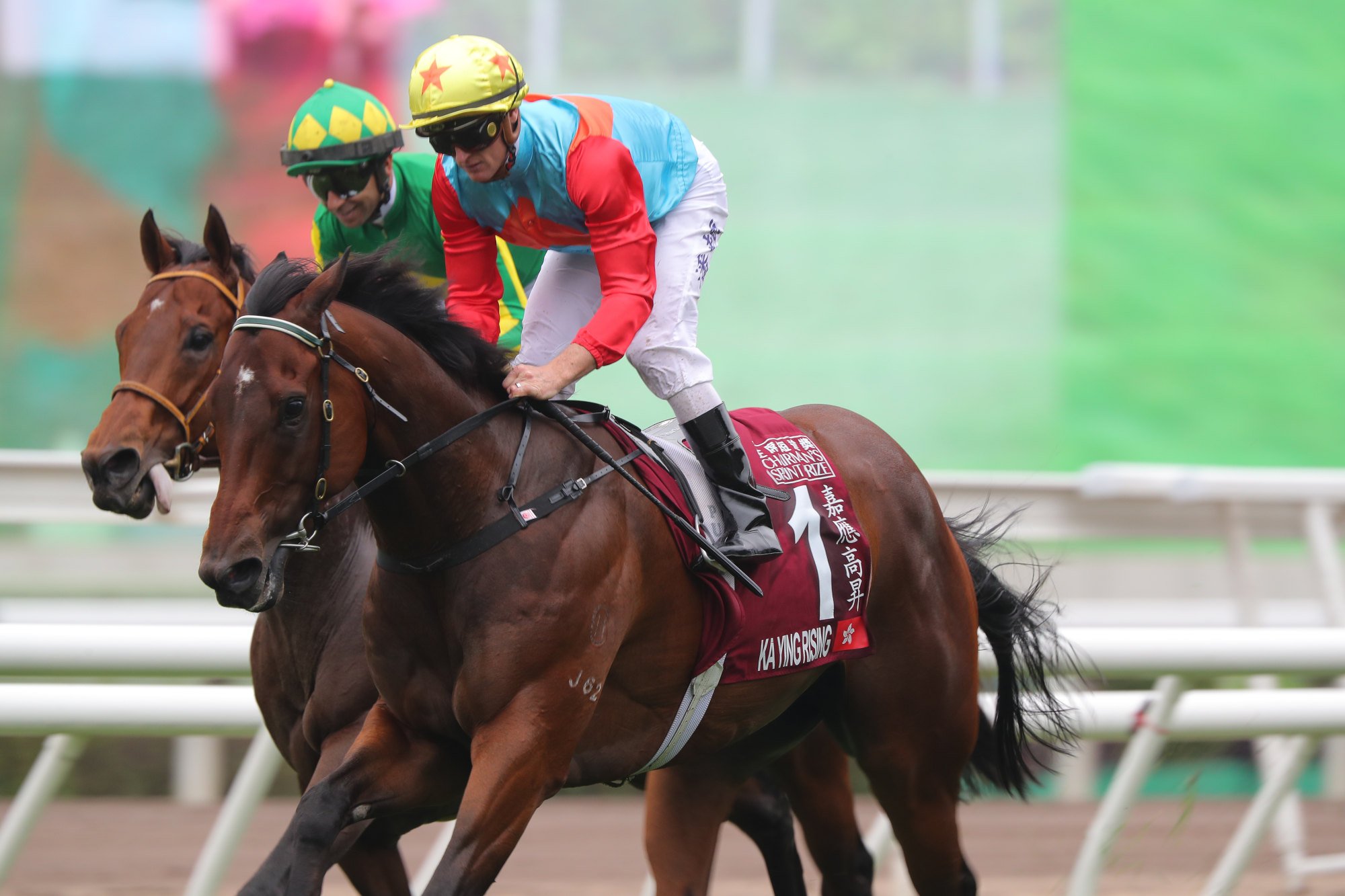 Zac Purton and Ka Ying Rising (outside) salute at Sha Tin. Zac Purton and Ka Ying Rising (outside) salute at Sha Tin.