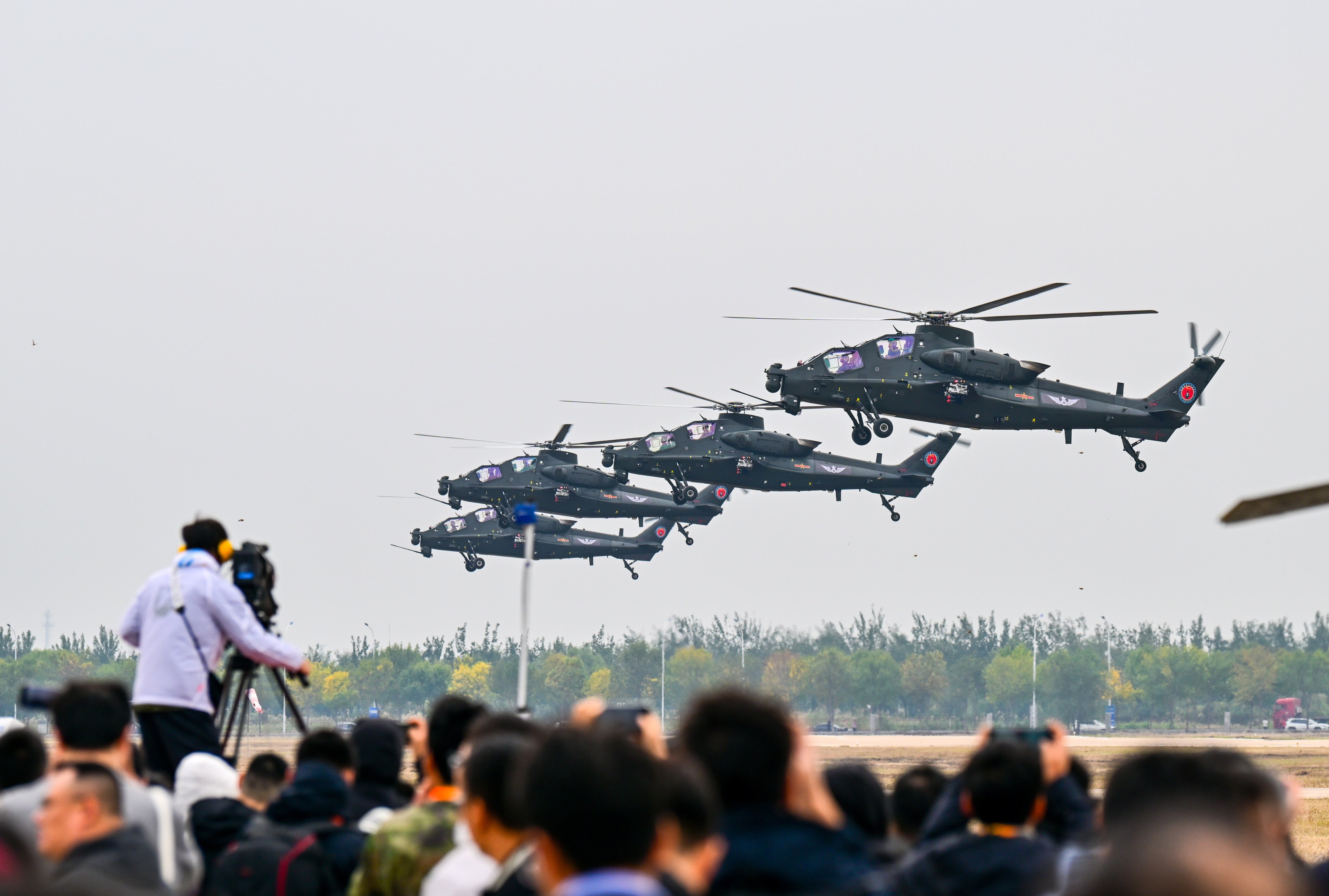 PLA helicopters in action during the opening ceremony of an annual exposition in Tianjin on Thursday. Photo: Xinhua