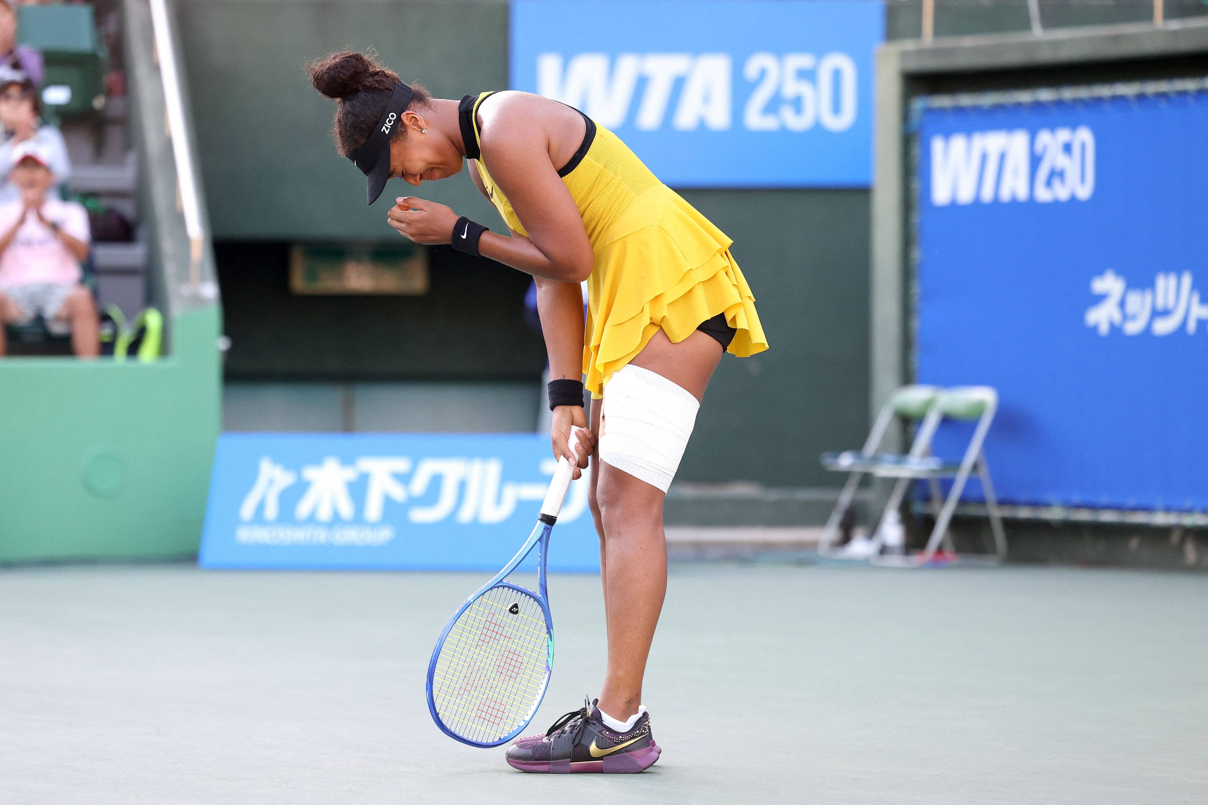 Naomi Osaka needed heavy strapping on her left leg to get through her Japan Open match against Suzan Lamens. Photo: AFP