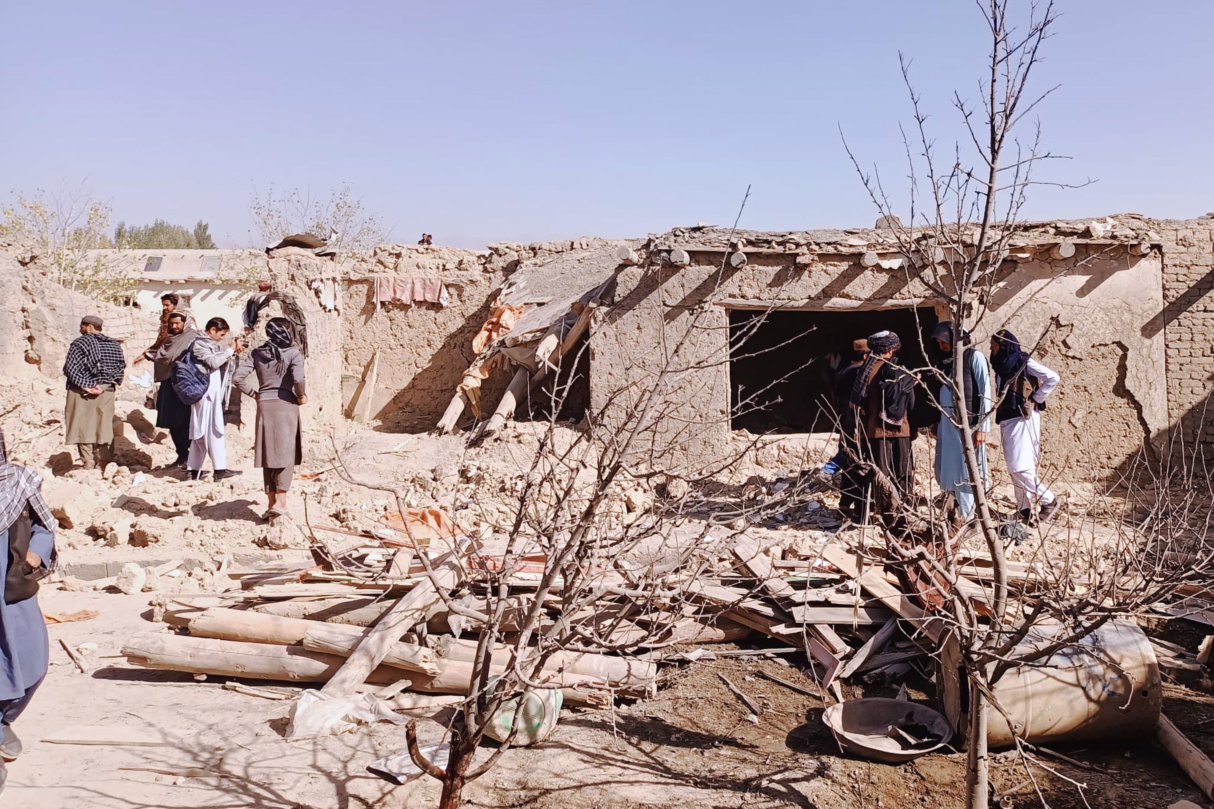 Locals inspect the site of a cross-border attack by the Pakistani army in Afghanistan’s eastern Paktika province on Saturday. Photo: AP