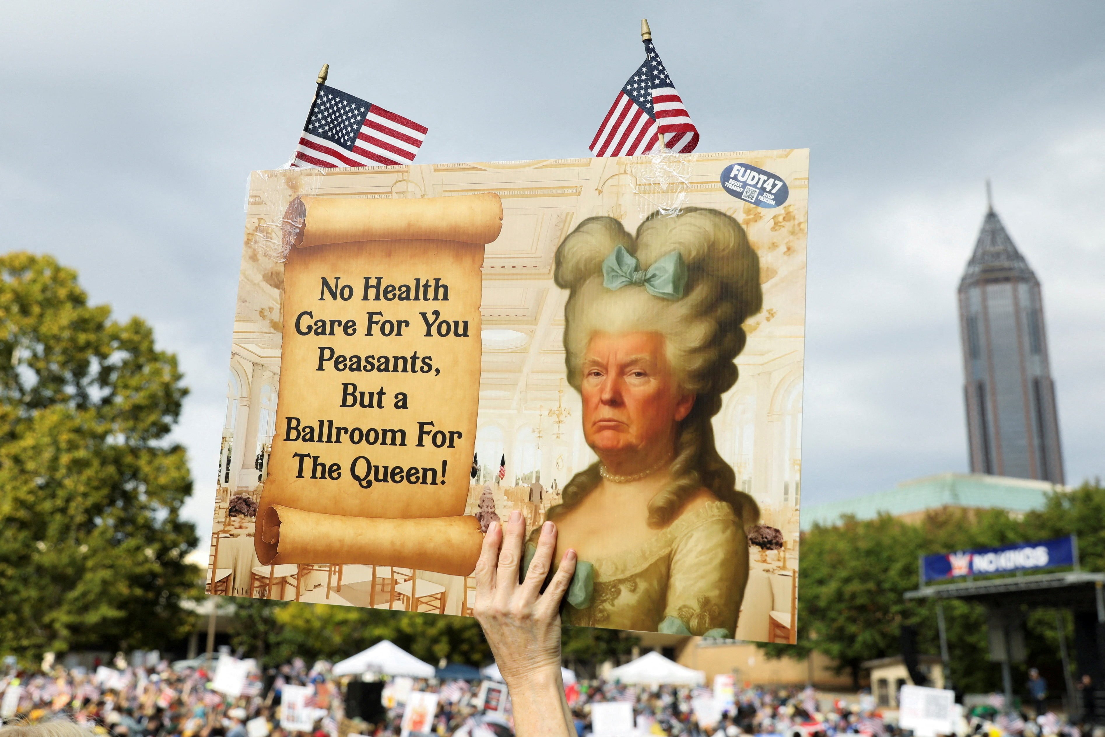 A person holds a placard with an image depicting US President Donald Trump as a queen, on the day of a “No Kings” protest against Trump’s policies, in Atlanta, Georgia, on Saturday. Photo: Reuters