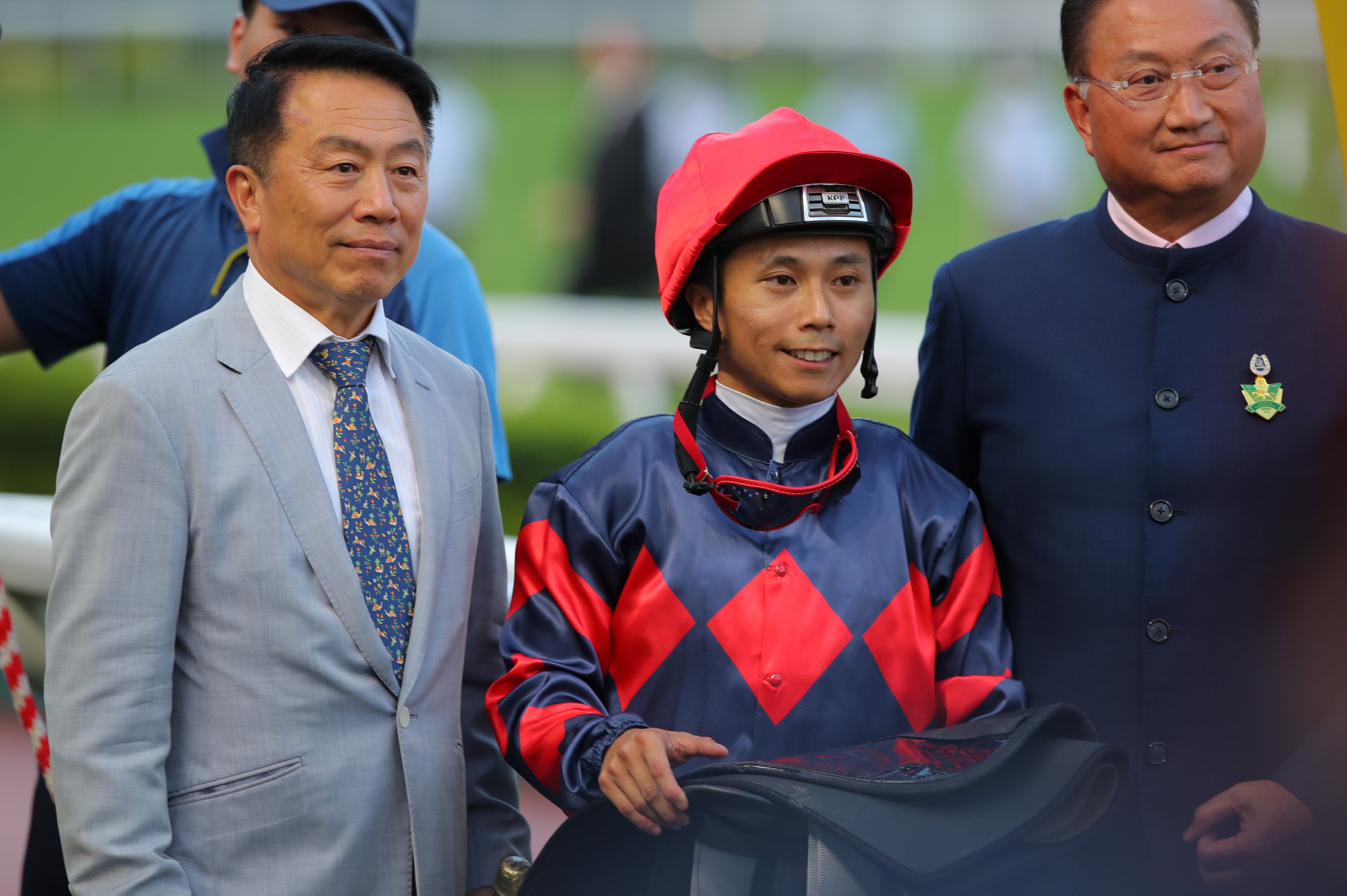 Jockey Matthew Poon, trainer Ricky Yiu (left) and connections celebrate Gracious Express’ win. Photos: Kenneth Chan
