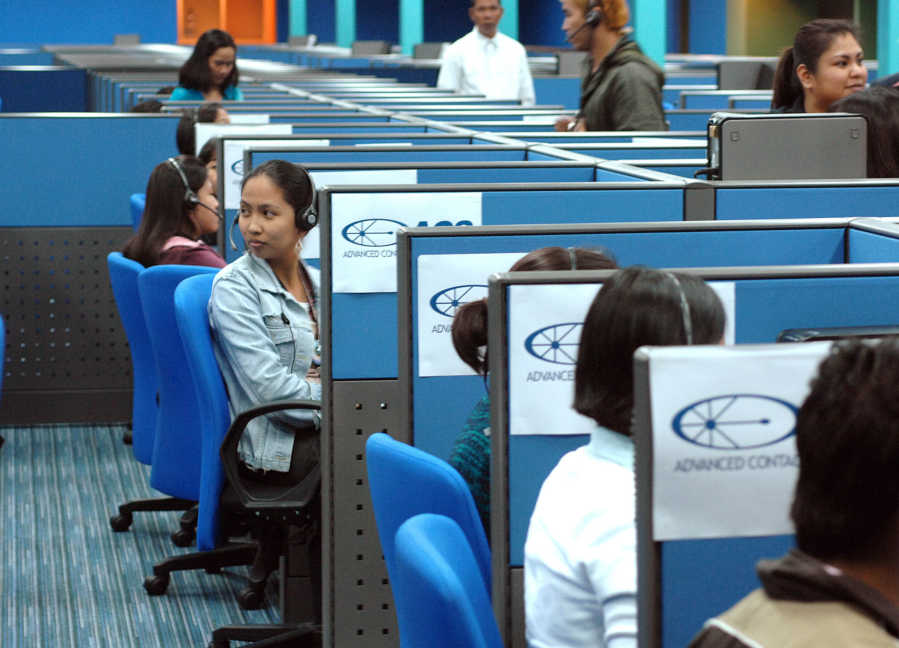 Filipino call centre workers attend to US-based clients at a BPO office in Manila. Photo: AFP