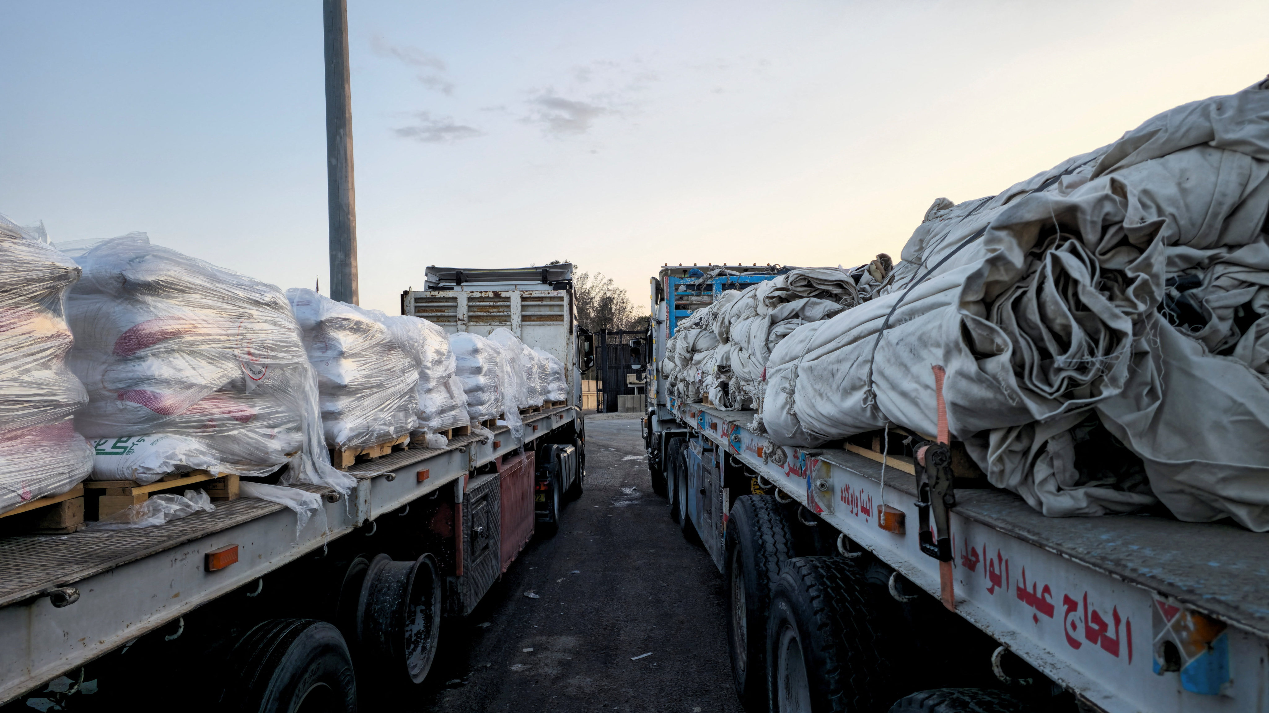 Trucks carrying humanitarian aid line up at the Egyptian side of the Rafah border crossing into Israel on Friday. Photo: Reuters