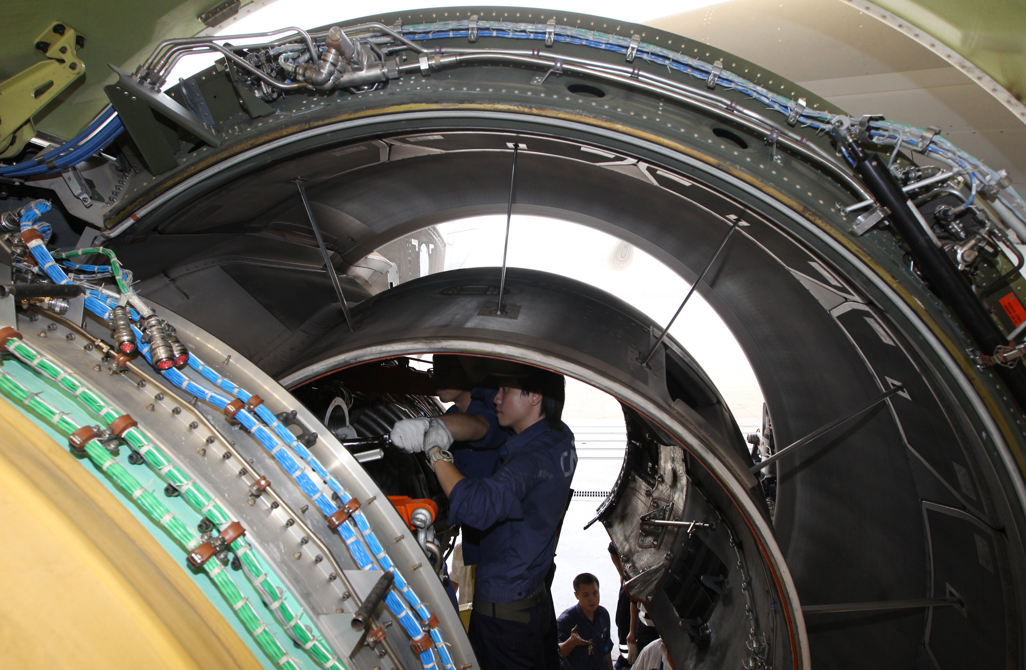 Engine maintenance is demonstrated on a Hong Kong Airlines plane at Hong Kong airport in 2012. Photo: SCMP