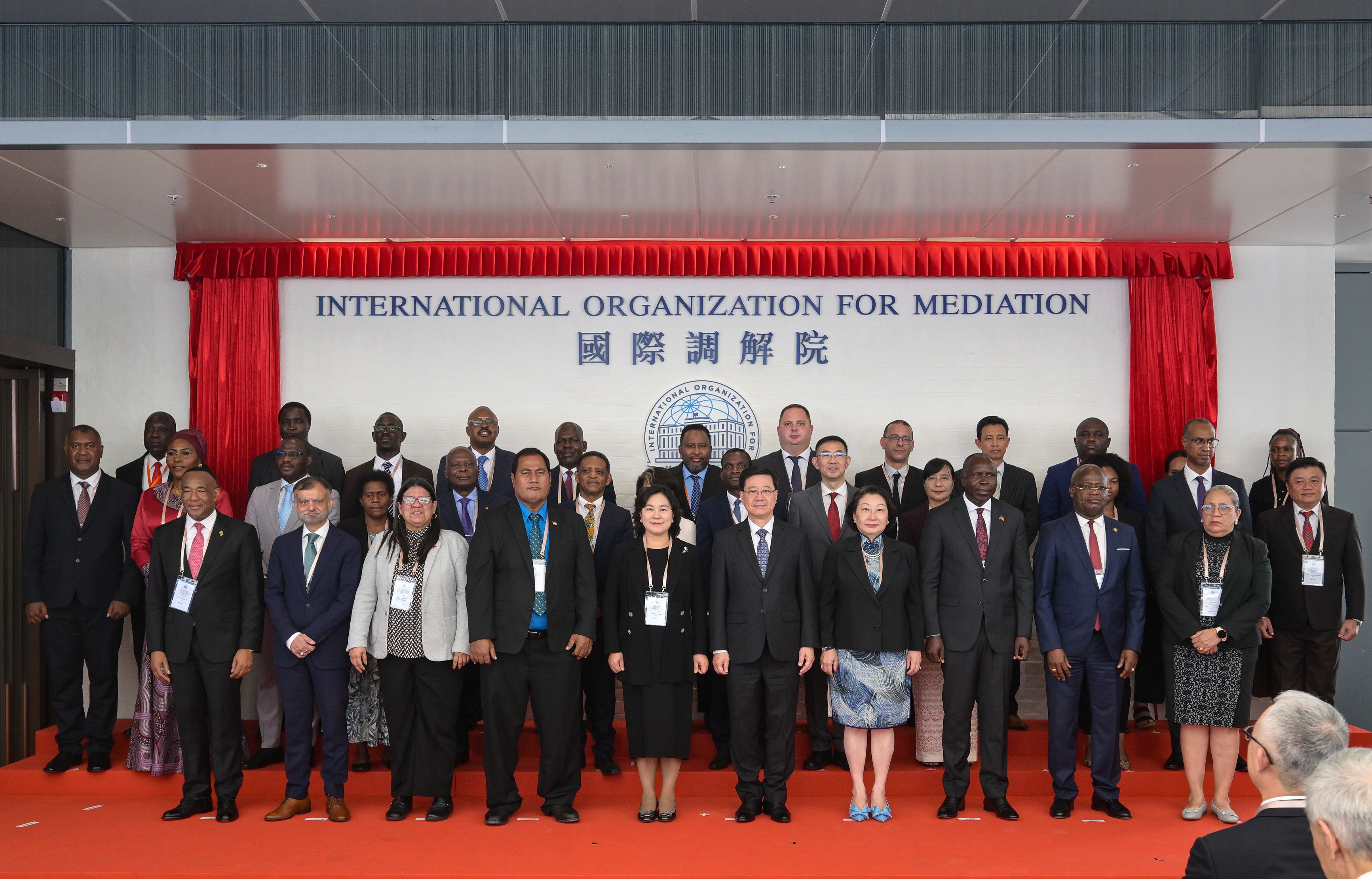 Hua Chunying (fifth left, front) with Chief Executive John Lee (centre) and Teresa Cheng (fifth right), the organisation’s secretary general, at the inauguration ceremony. Photo: Handout