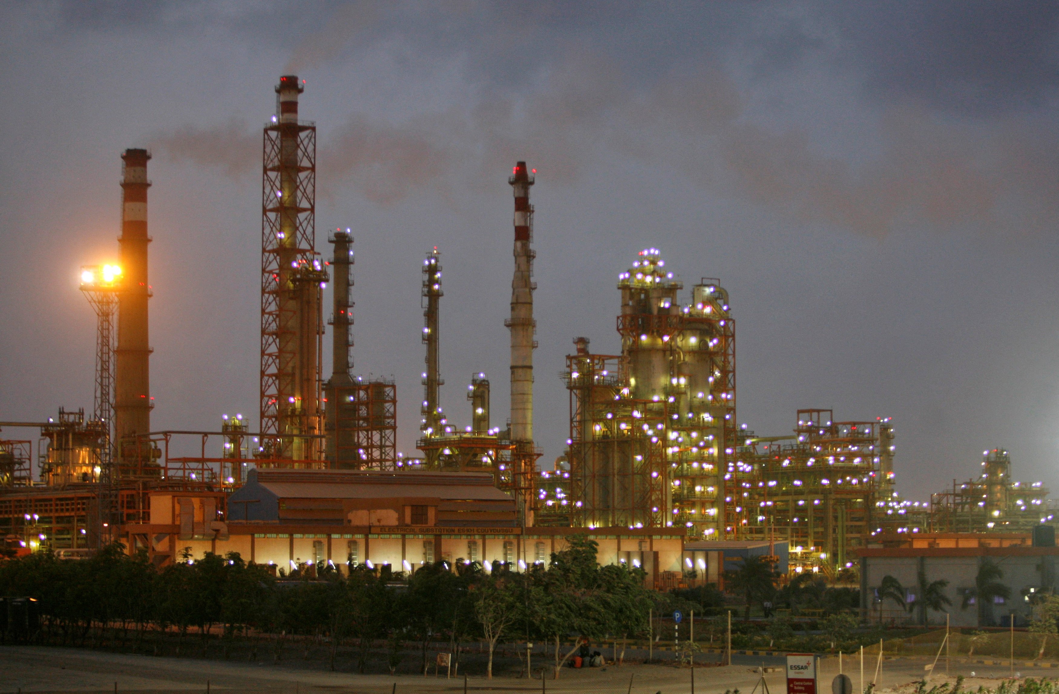 An oil refinery in Gujarat state, India, pictured at dusk. Photo: Reuters
