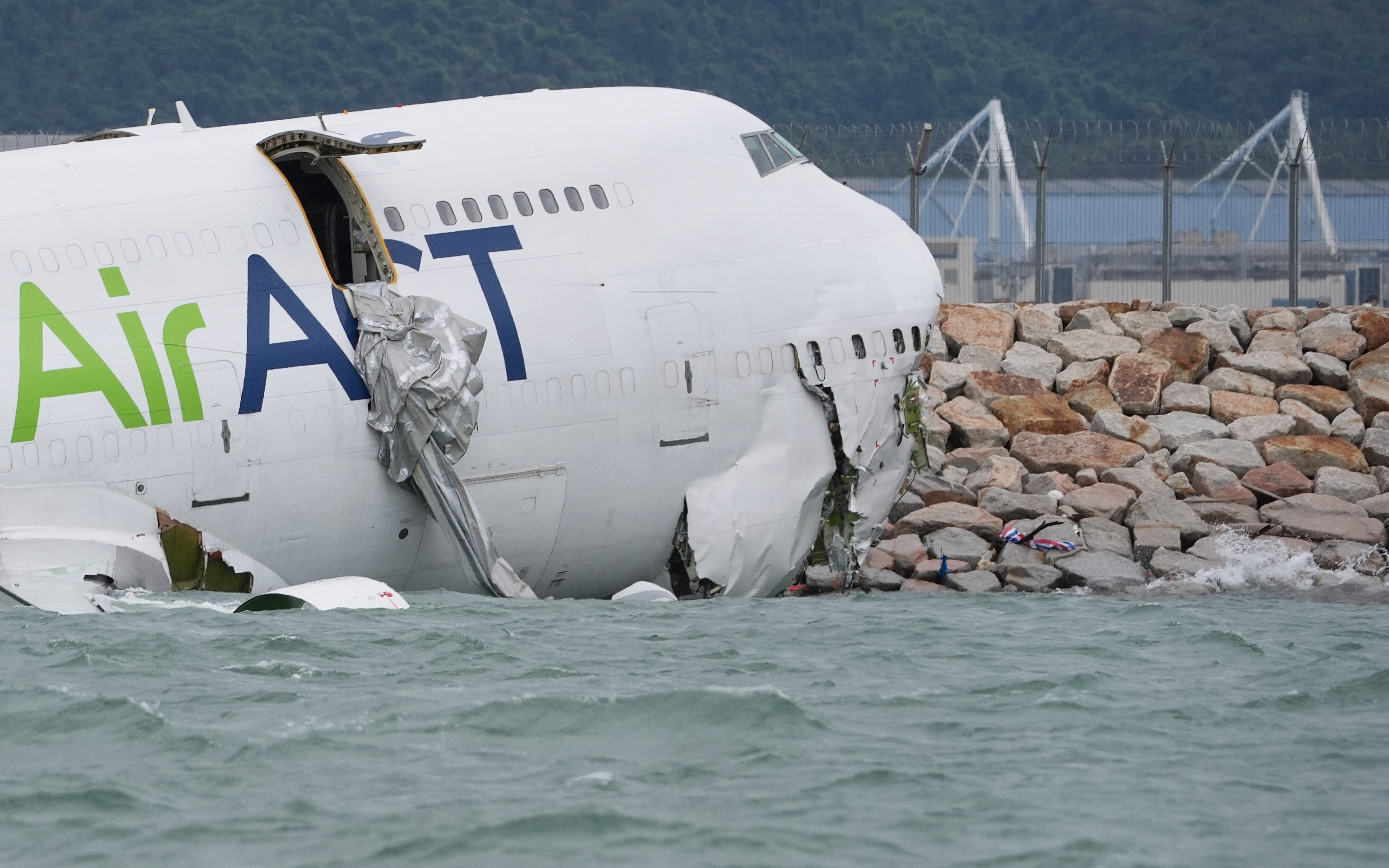 The wreckage of the cargo plane on the shore near Hong Kong International Airport’s north runway. Photo: Elson Li