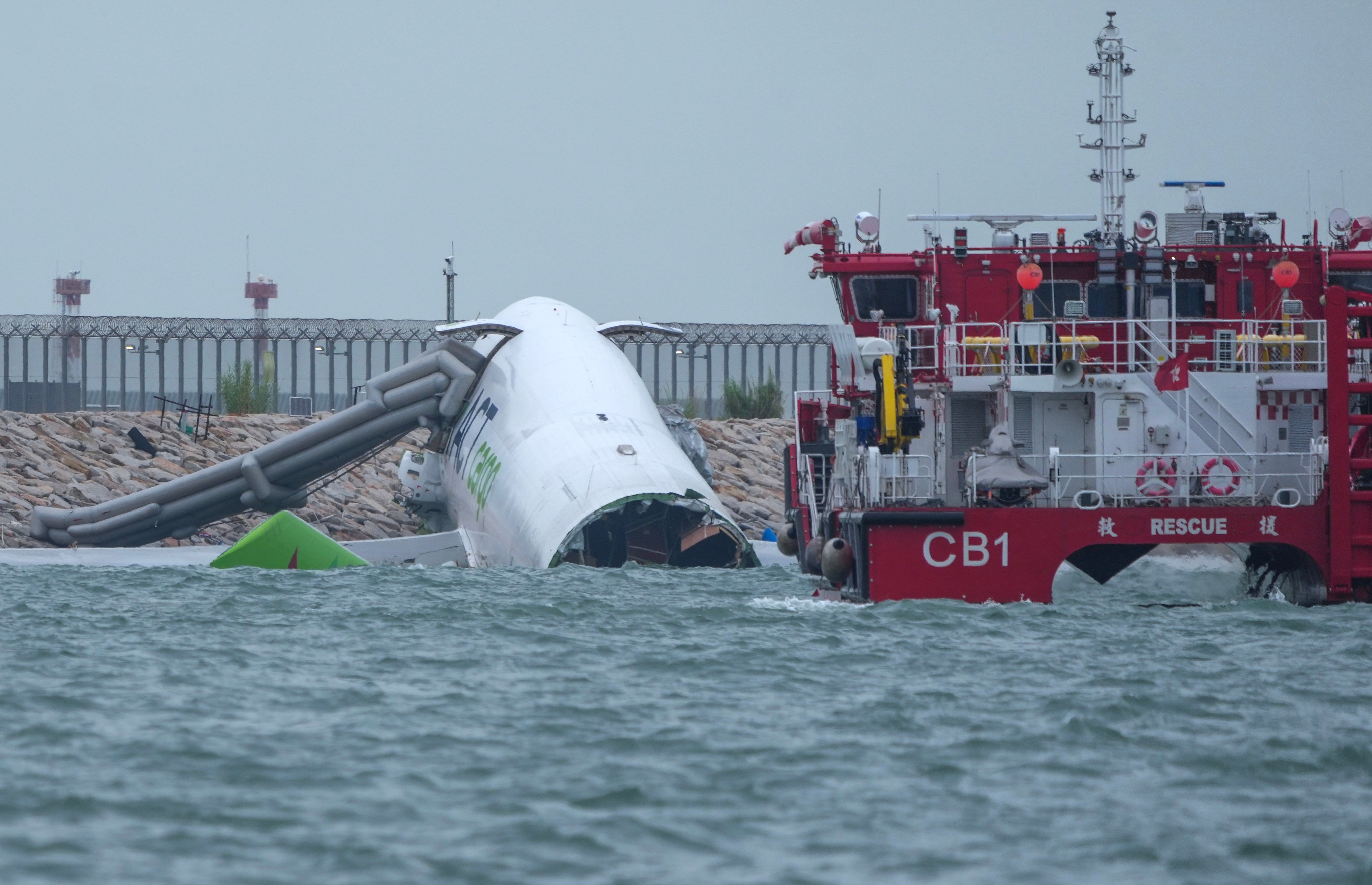 Flight EK9788 swerved off Hong Kong airport’s north runway while landing and struck a security patrol vehicle, killing two, on Monday morning. Photo: Sam Tsang